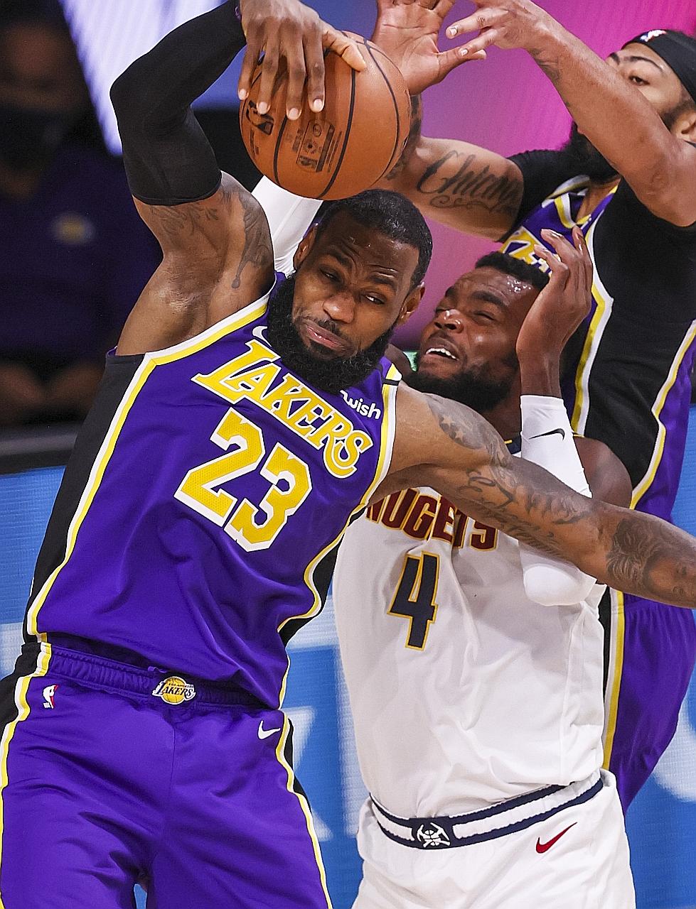 Three-time Finals Most Valuable Player LeBron James en route to recording a triple-double against the Nuggets with 38 points, 16 rebounds and 10 assists and sealing the Los Angeles Lakers' berth in the NBA Finals for the 32nd time. Below: All-Star fo