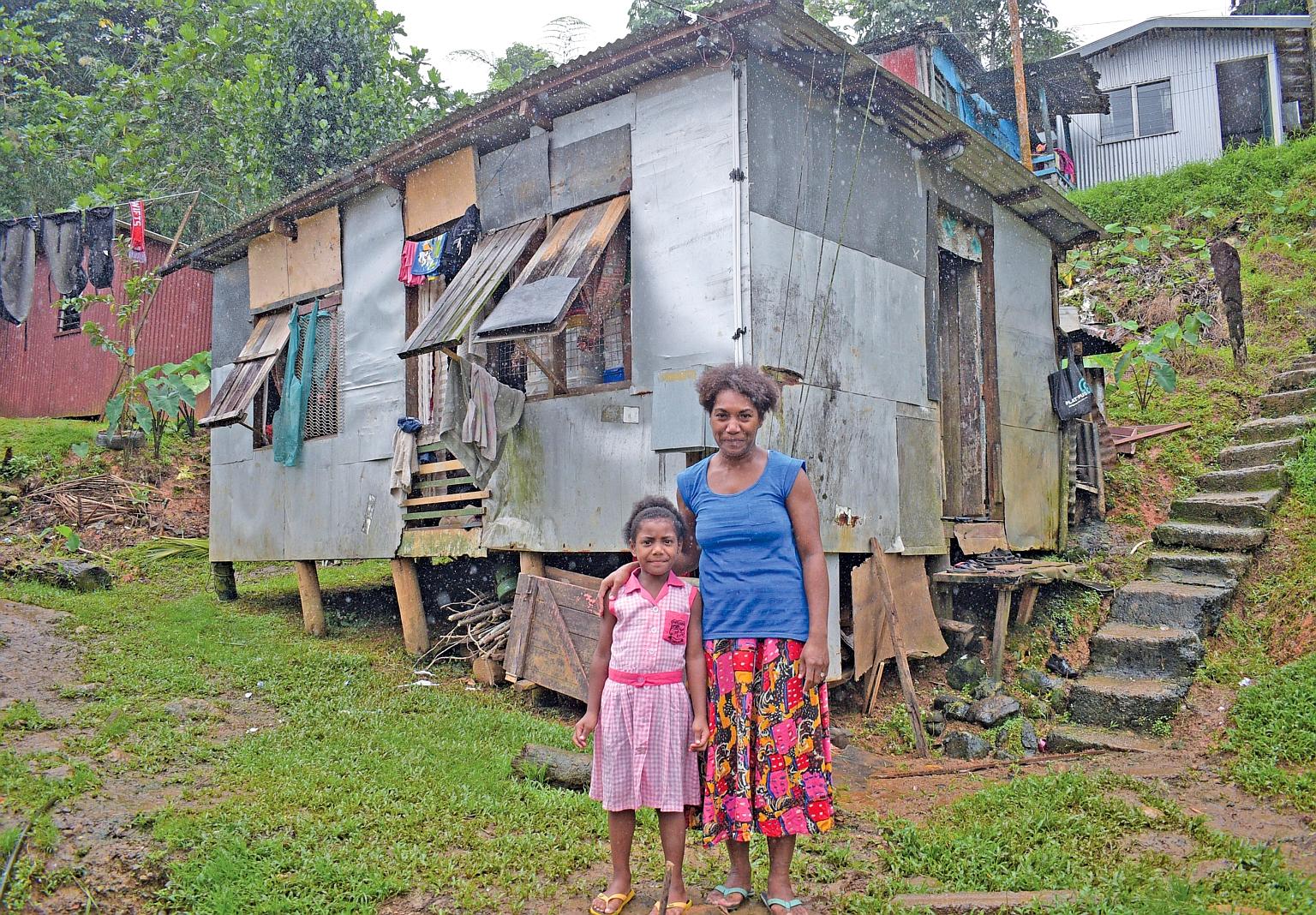 Right and far right: Ms Temalesi Tauga with her six-year-old daughter Keran Alice at their Kalekana home in the Fijian capital city of Suva. Ms Tauga now has an almost-new stove, a full cylinder of gas and ingredients to start a baking business, afte