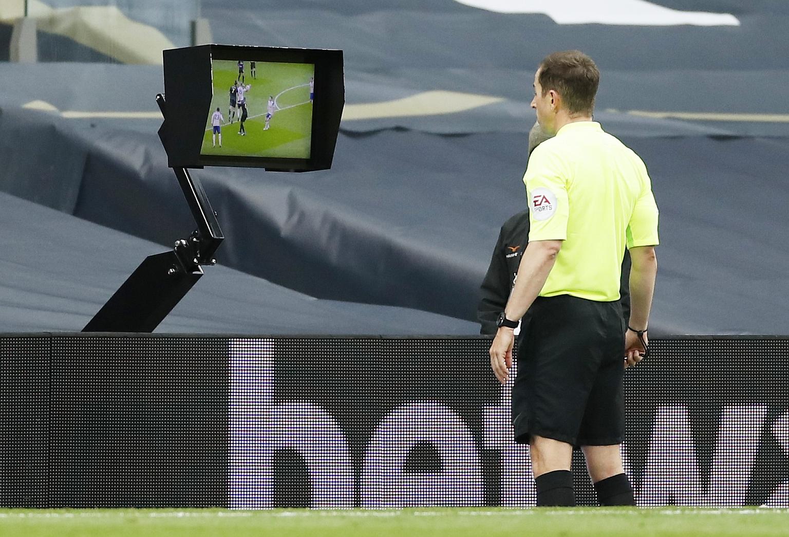 Referee Peter Bankes checking the video assistant referee monitor before awarding a hotly disputed penalty to Newcastle in added time, enabling the visitors to escape with a 1-1 draw at Tottenham on Sunday. The handball incident was the latest in a s