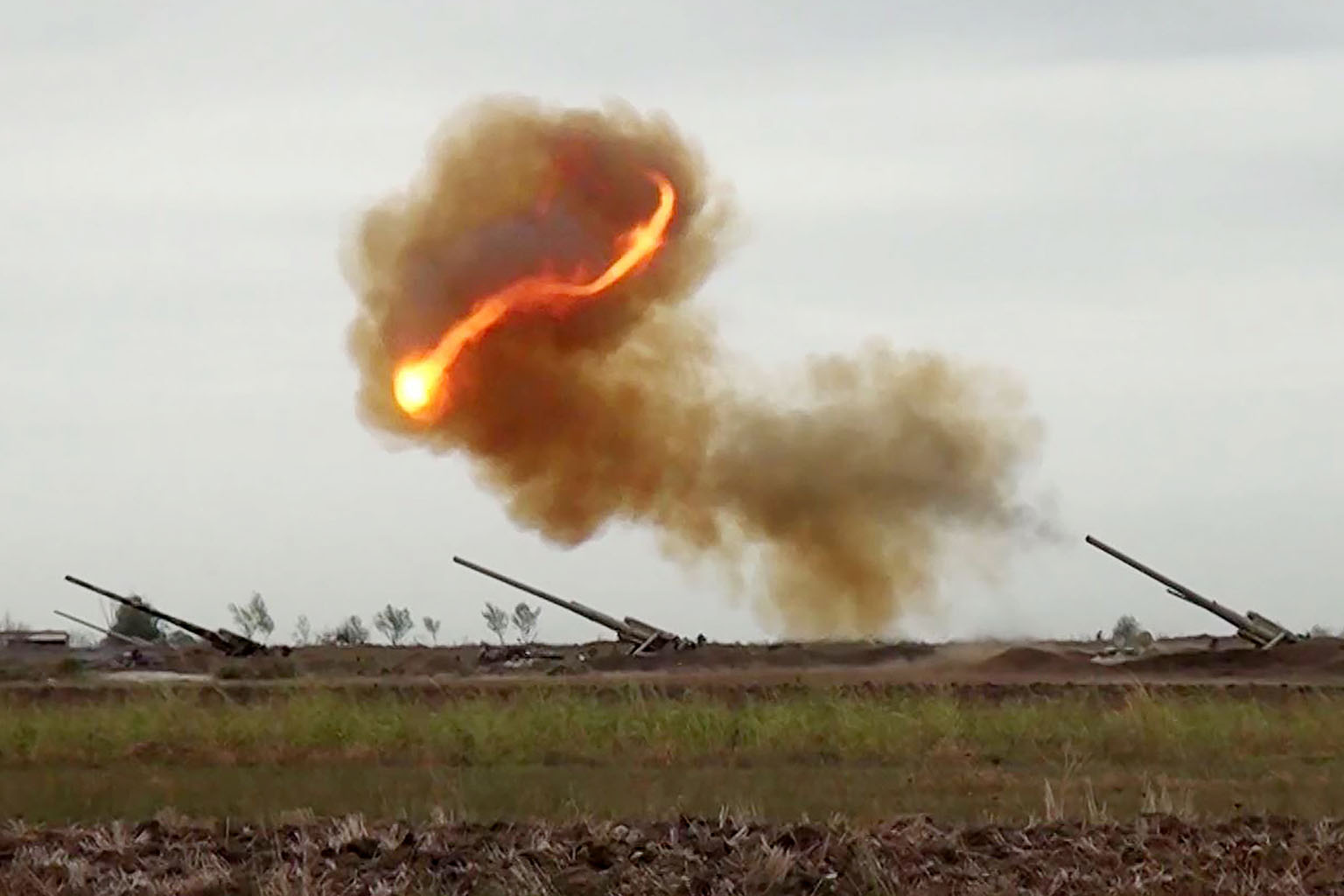 An image grab taken from a video made available on the Azerbaijani Defence Ministry's official website on Monday. It allegedly shows Azeri artillery launching strikes towards the positions of Armenian separatists in the breakaway region of Nagorno-Ka
