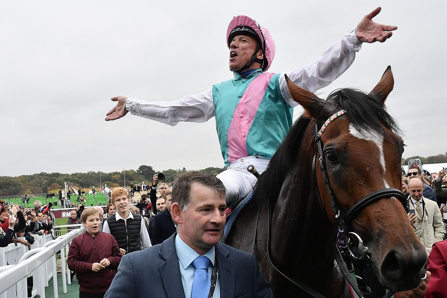 Jockey Frankie Dettori celebrating after Enable's Prix de l'Arc de Triomphe victory in 2018.
