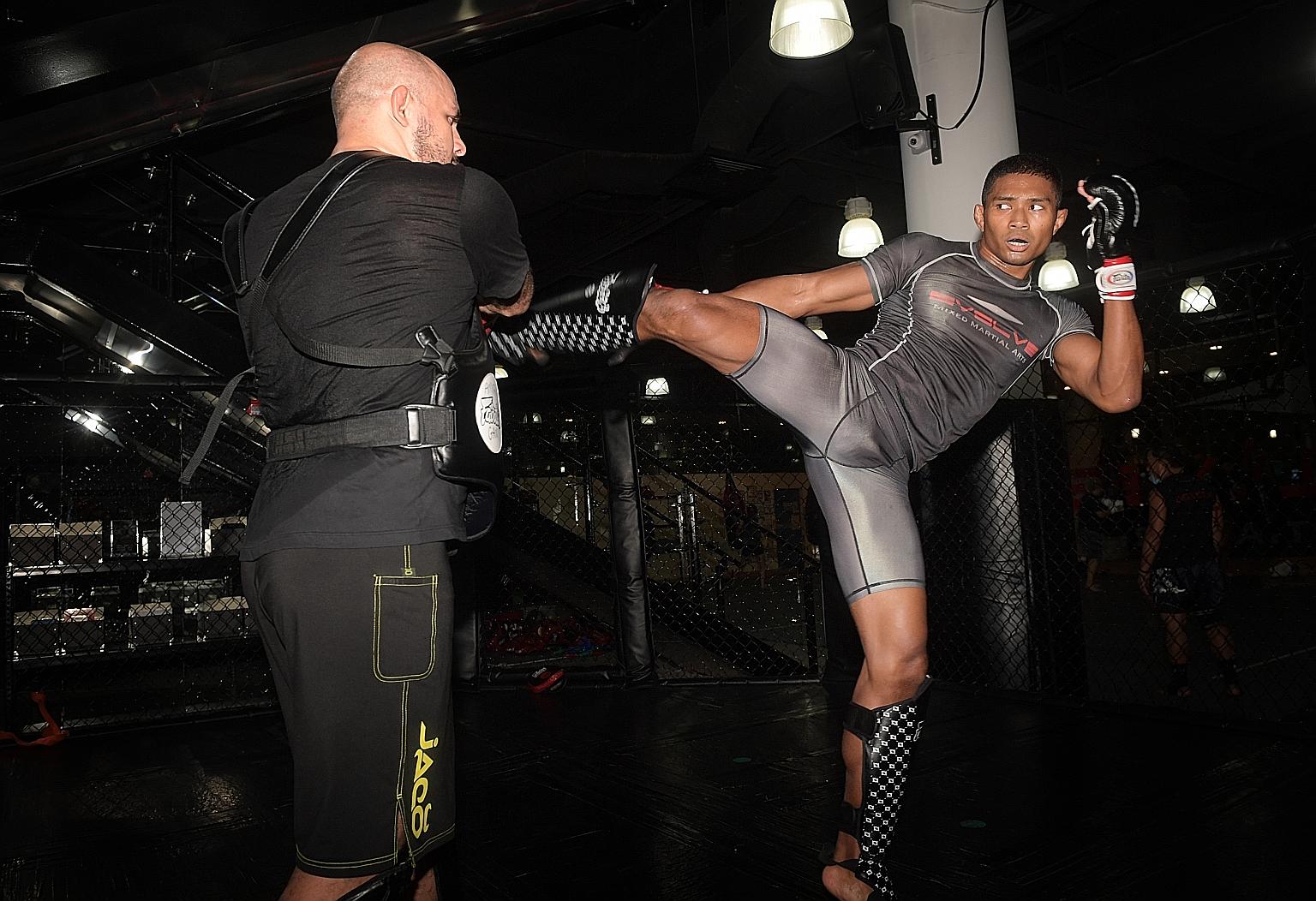 Singapore mixed martial arts fighter Amir Khan has been in training since Phase Two began in June, in preparation for his bout against permanent resident Rahul Raju next Friday.