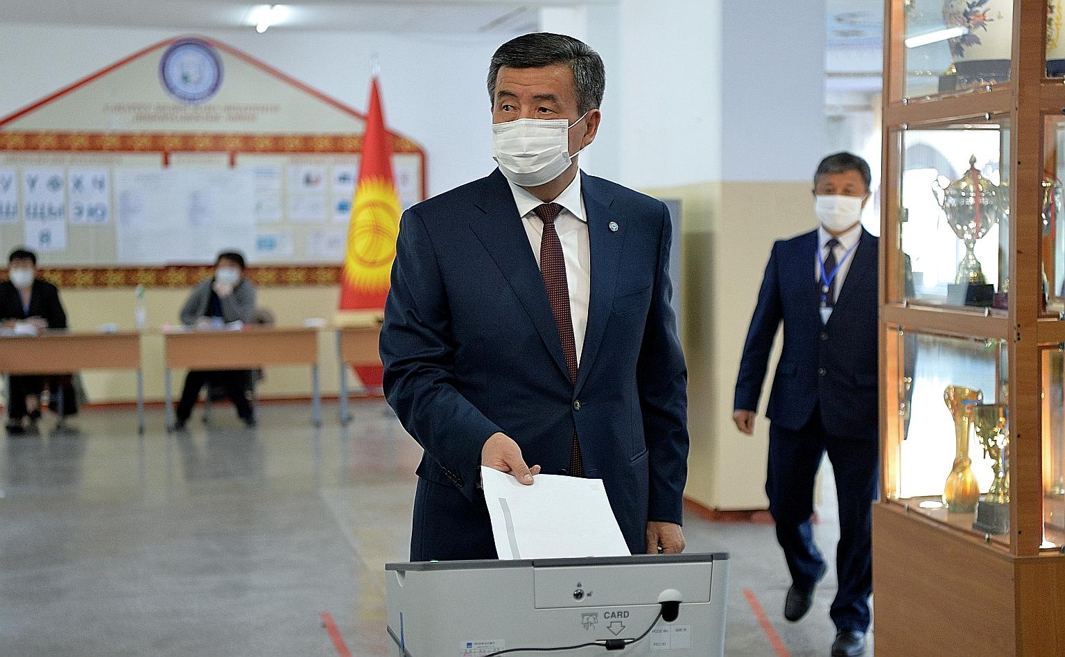 Kyrgyzstan President Sooronbai Jeenbekov casting his vote yesterday in the capital Bishkek. A total of 16 parties are contesting 120 seats in the single-chamber Parliament.