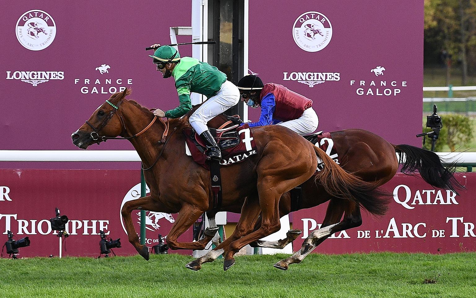 Italian jockey Cristian Demuro celebrates after Sottsass clinched victory in the Prix de l'Arc de Triomphe race in Paris. It is trainer Jean-Claude Rouget's first victory in the 2,400m Group 1 contest.