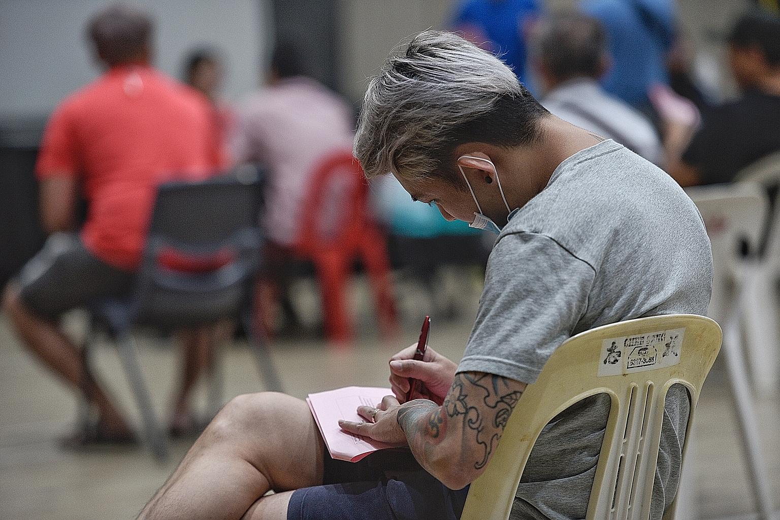 A man in April applying for the Temporary Relief Fund, which provides cash help to those financially affected by the pandemic. More support is being extended to individuals and businesses that need help.