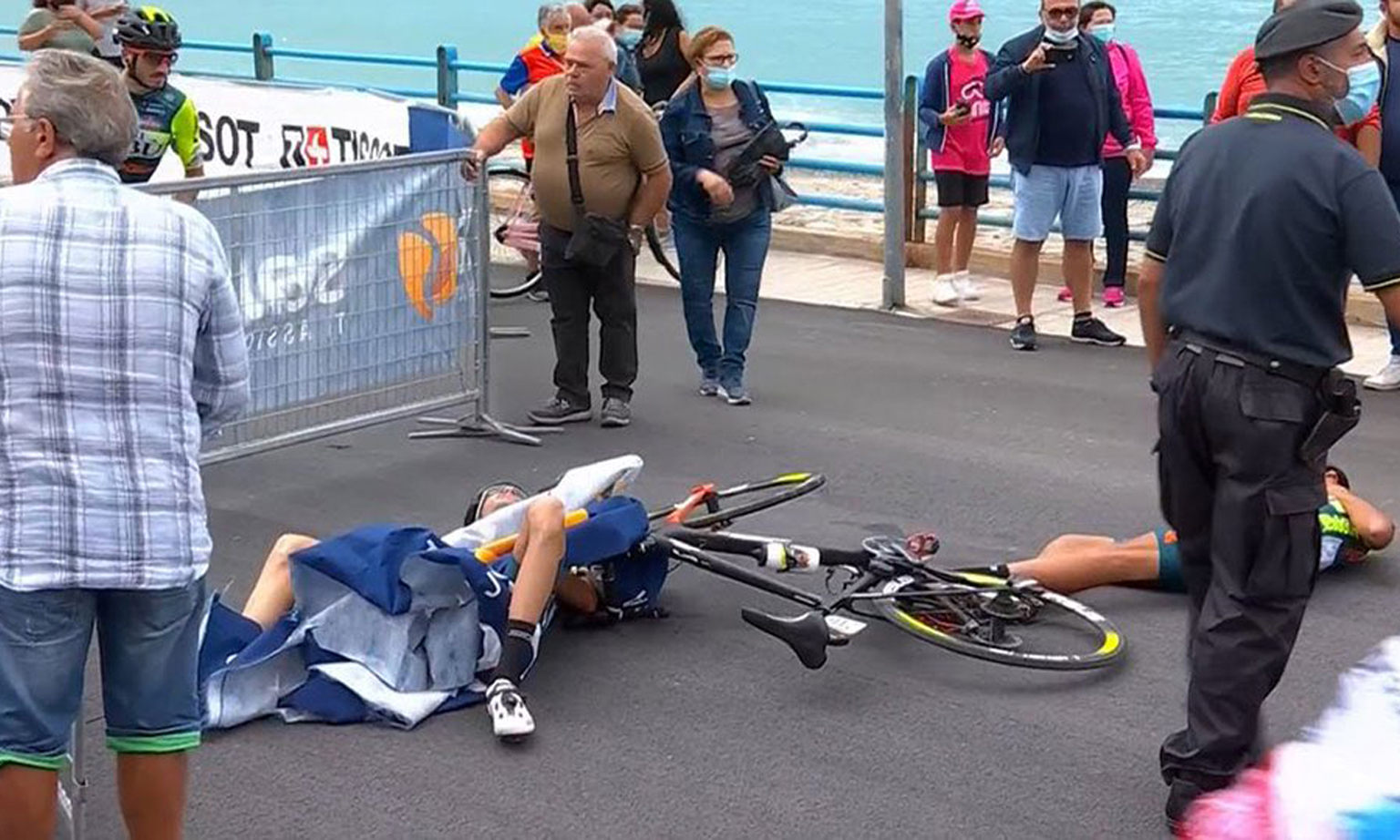 Italian cyclist Luca Wackermann was struck by a barrier blown over by a helicopter. 
