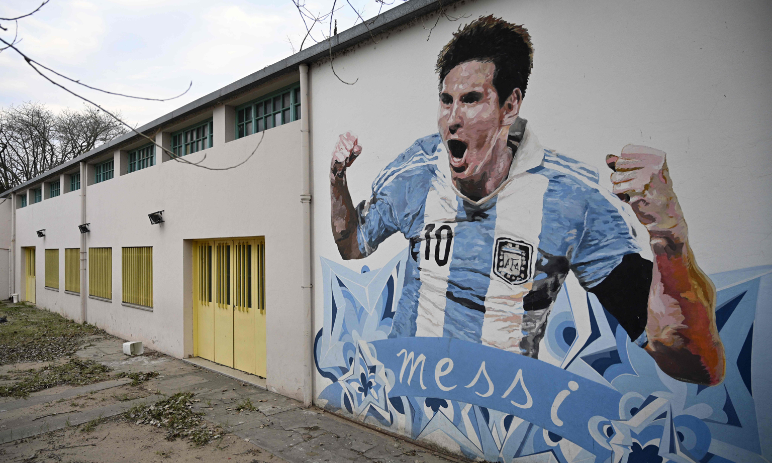 Lionel Messi, depicted in a mural in Buenos Aires, will lead Argentina out for the World Cup qualifier against Ecuador today. 