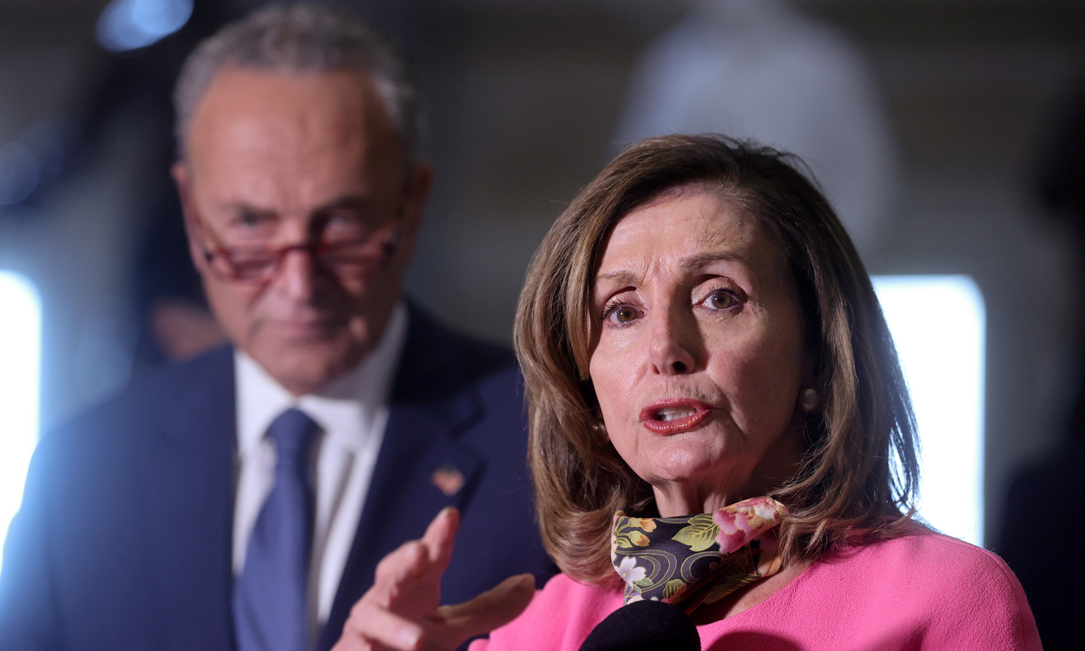 US House Speaker Nancy Pelosi and Senate Minority Leader Chuck Schumer speaking to reporters in August. President Donald Trump has accused Mrs Pelosi of inflating the pandemic relief package to "bail out poorly run, high crime, Democrat States".