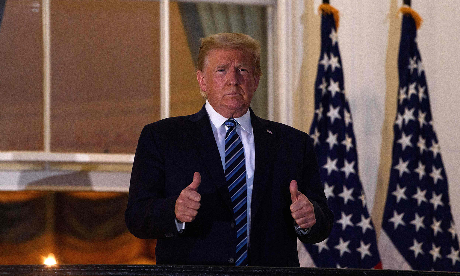 US President Donald Trump giving the thumbs up from the Truman Balcony upon his return to the White House on Monday from Walter Reed Medical Centre, where he underwent treatment for Covid-19.