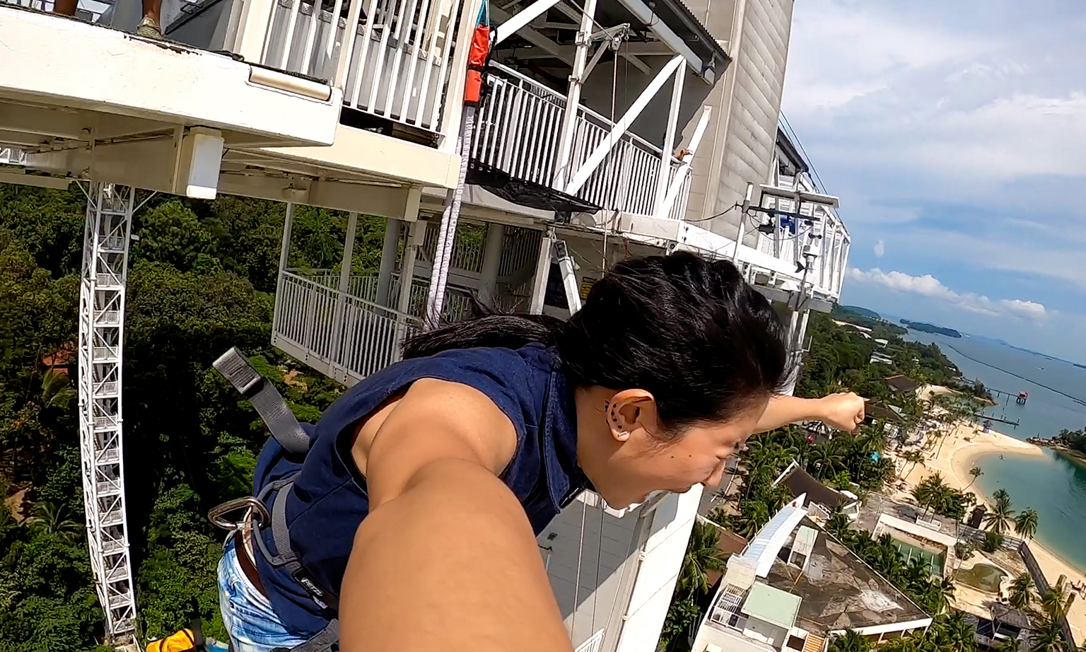 The writer finally letting go of her fear and leaping off from the bungee jump tower.