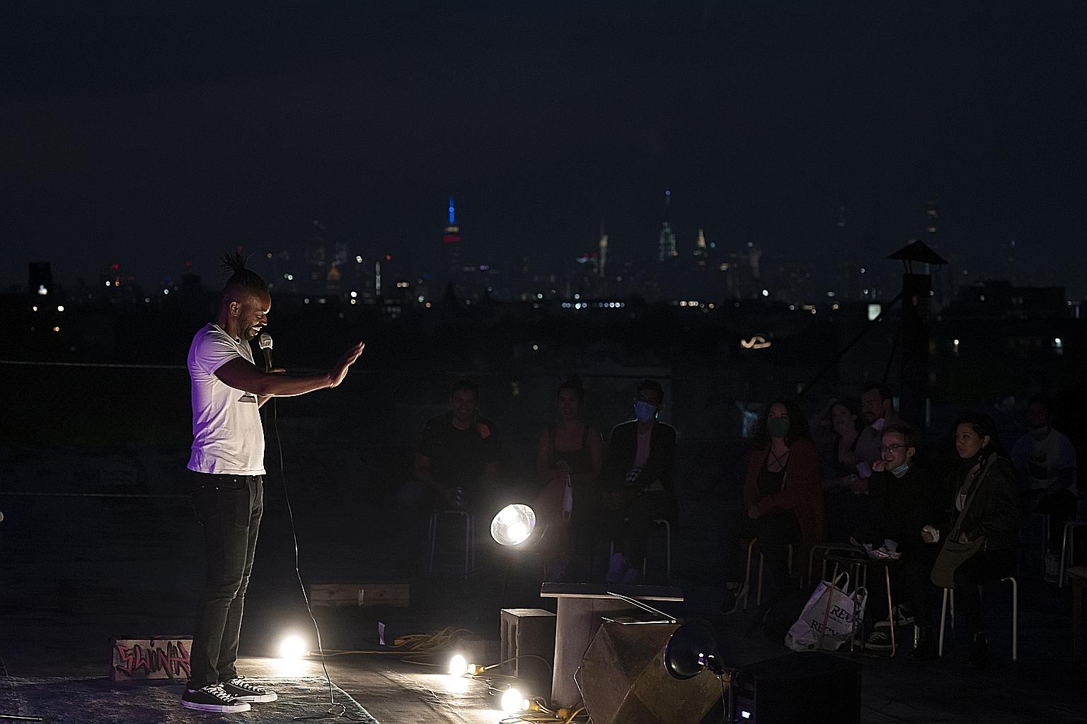 Comedian Chris Hamilton performing on a rooftop in Brooklyn, New York. With comedy clubs closed, more performers are taking such pop-up gigs.