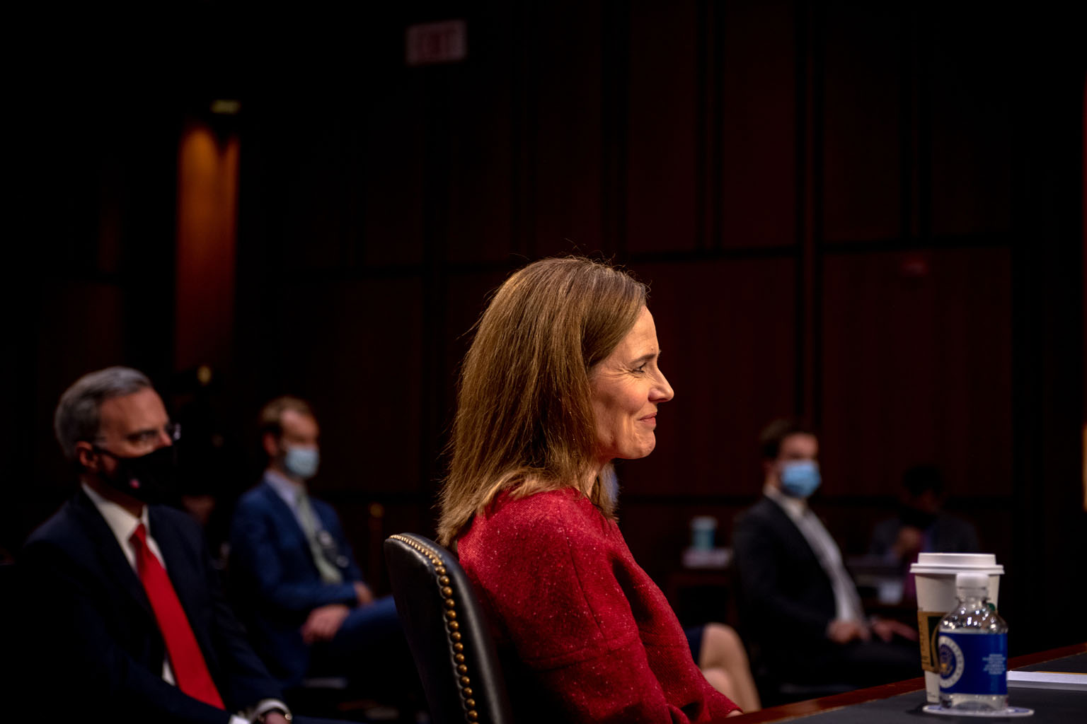 Mrs Amy Coney Barrett has played down her history of taking conservative stances in legal writings and personal statements.
