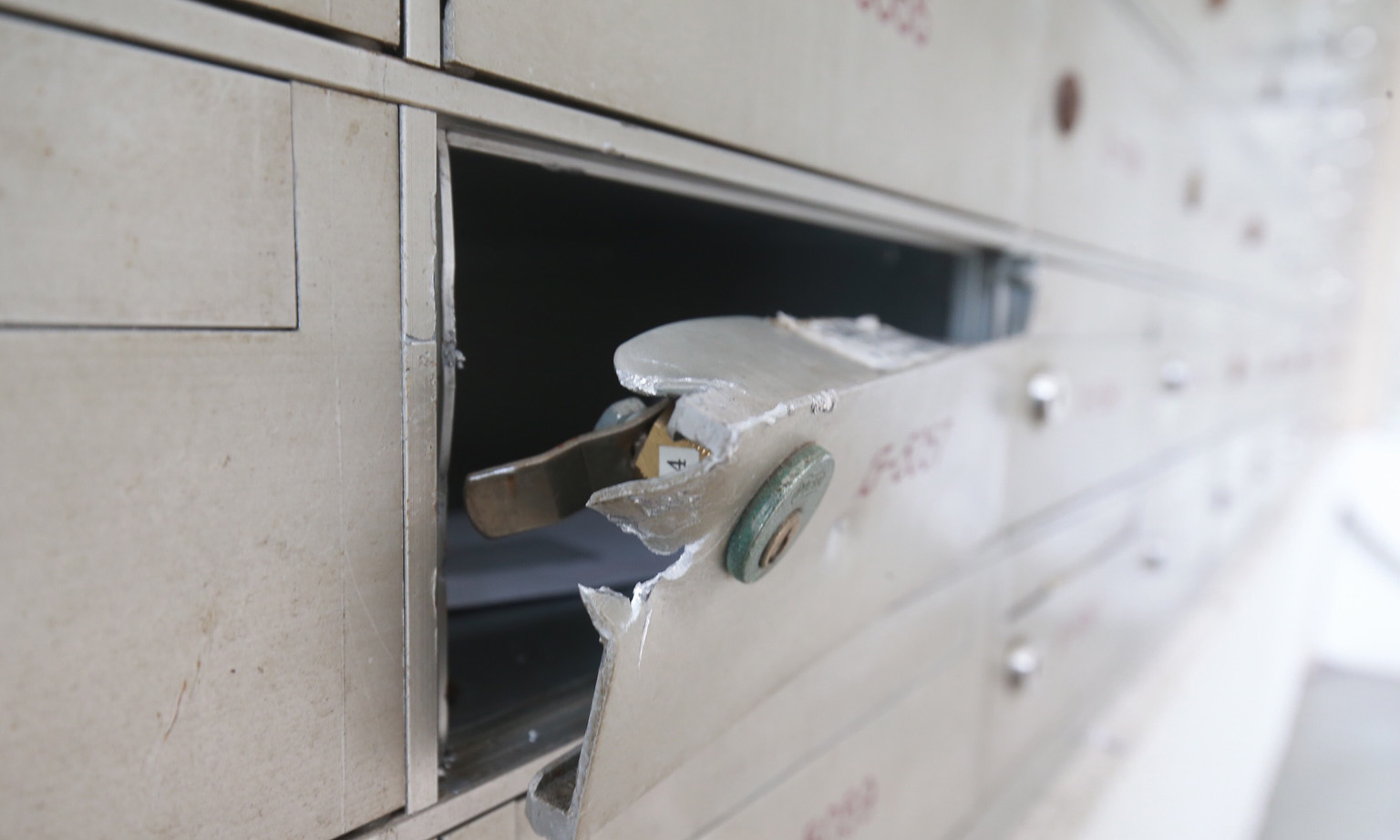 Police said yesterday that they have received reports of letterboxes in Marsiling (left) and Bukit Merah being tampered with. PHOTO: LIANHE ZAOBAO