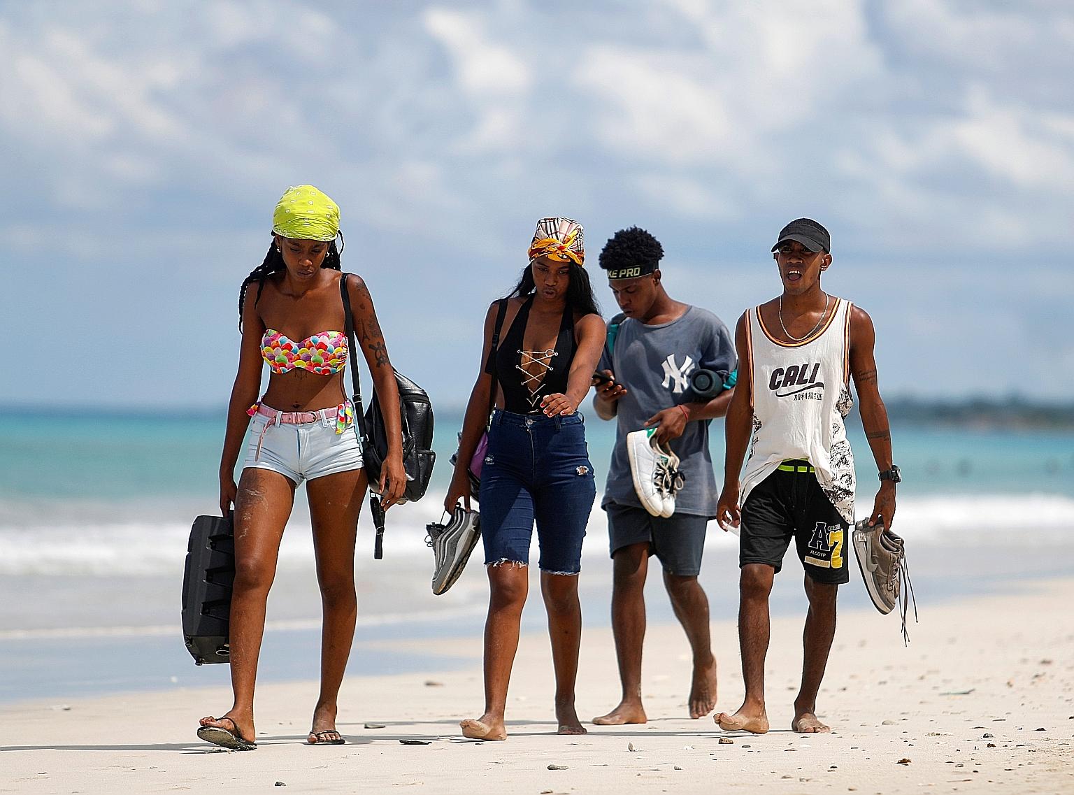 Young beachgoers in Havana, Cuba, earlier this week. Despite the global push for a Covid-19 vaccine, speedy, mass shots are unlikely, says the World Health Organisation's chief scientist.