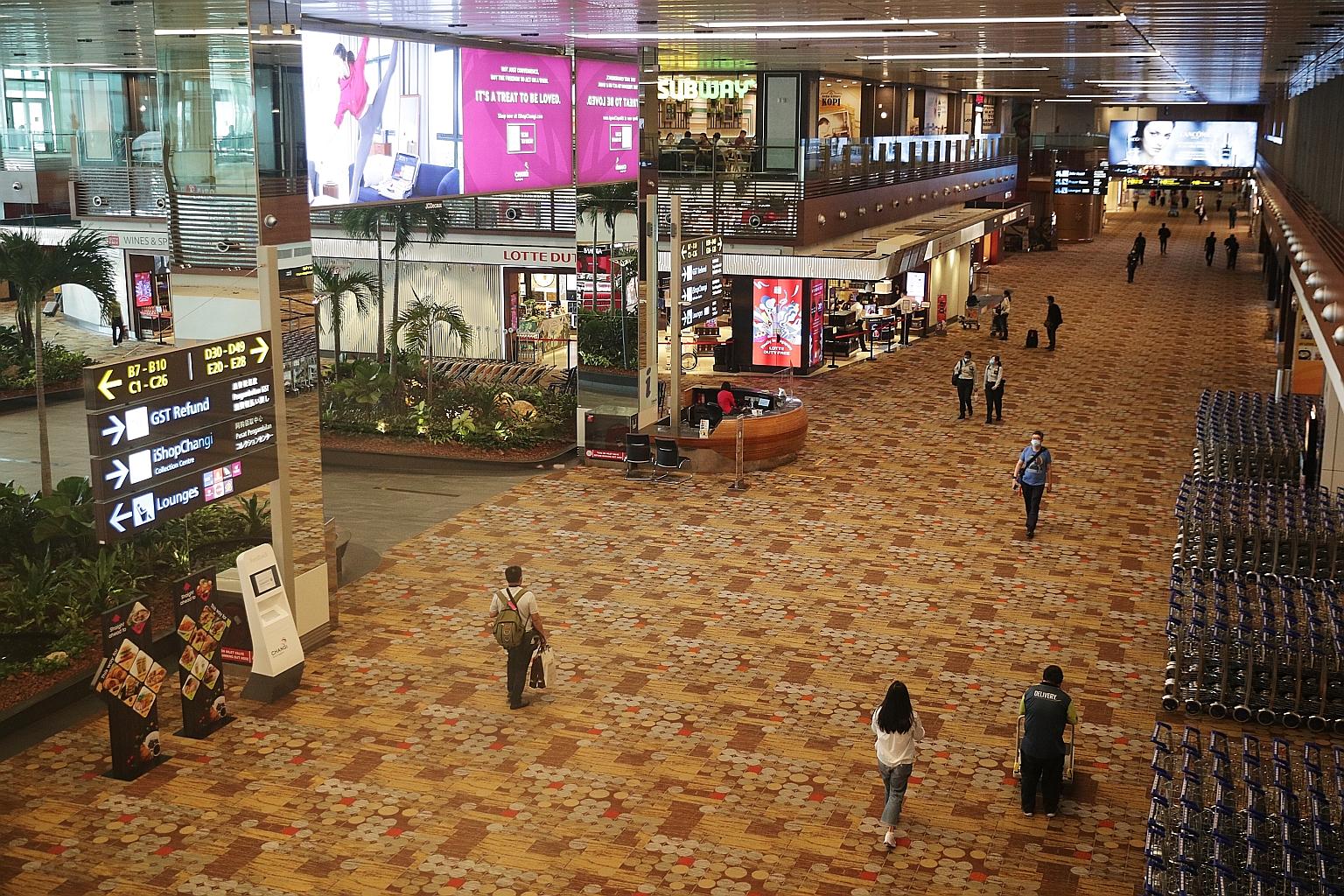 The transit area of Changi Airport's Terminal 1 on Wednesday. The construction of Terminal 5 has been put on hold for two years. Deputy Prime Minister Heng Swee Keat said there could be further deferments or reductions in scale if travel demand takes