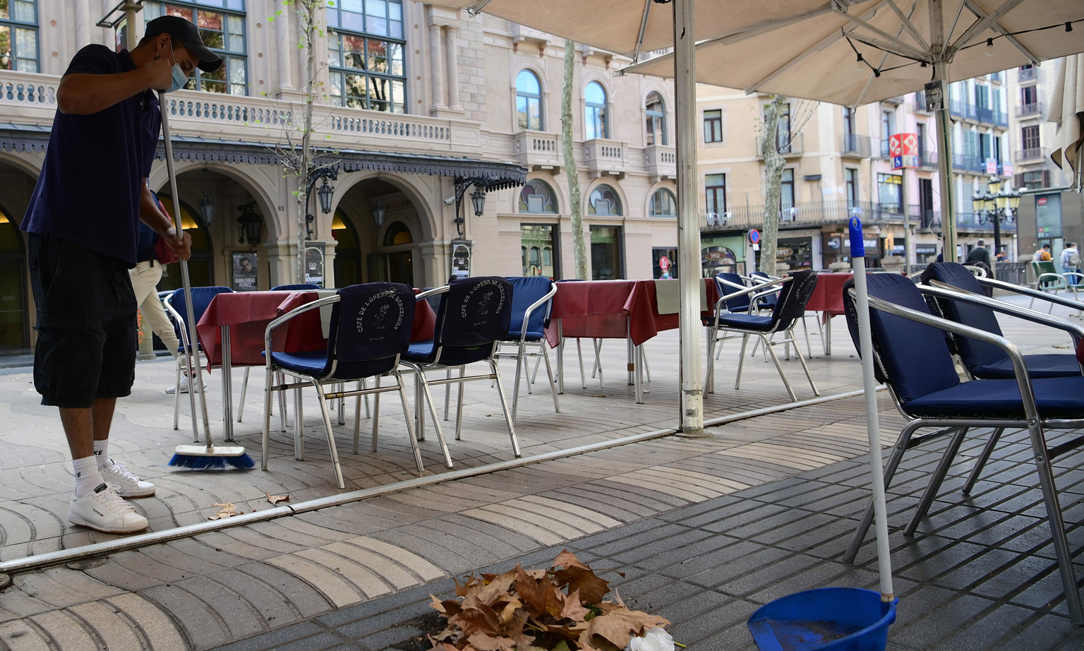 The outdoor seating area of a restaurant in the Spanish city of Barcelona where bars and restaurants have been ordered closed for 15 days from yesterday to curb a surge in coronavirus cases. The International Monetary Fund projects a partial and unev