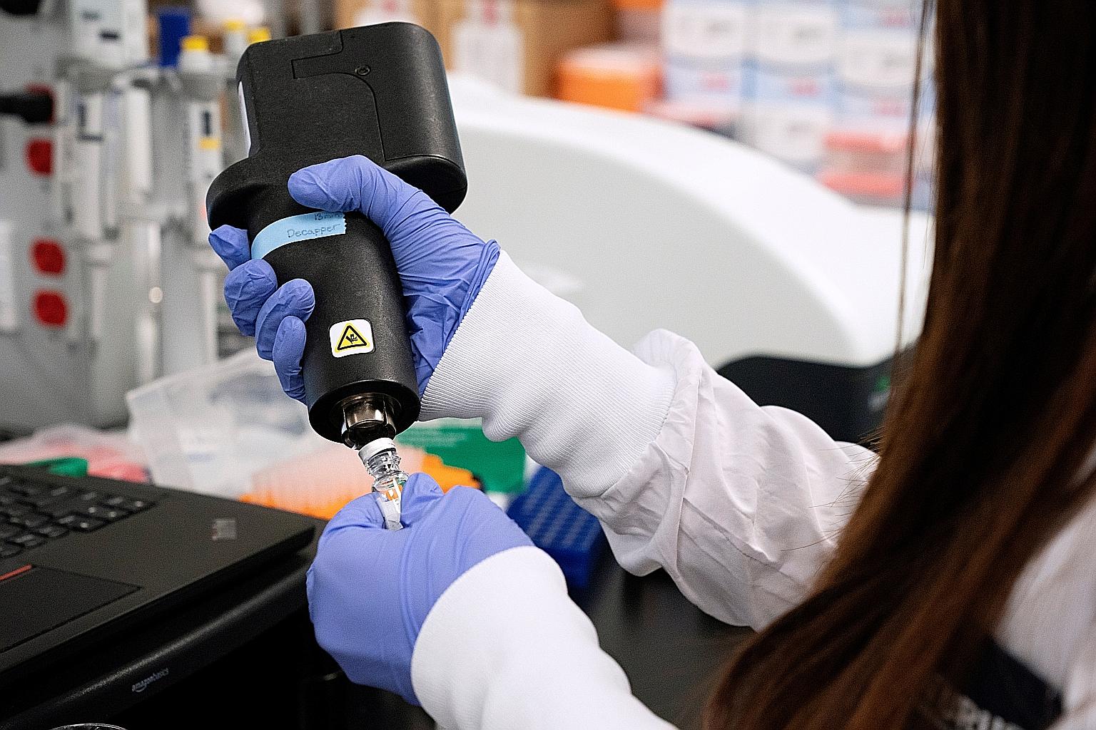 A scientist working on a vaccine for the coronavirus at a laboratory of Arcturus Therapeutics in California in March. There is currently only one Covid-19 vaccine candidate being tested here, the Lunar-CoV19 jointly developed by Duke-NUS and Arcturus