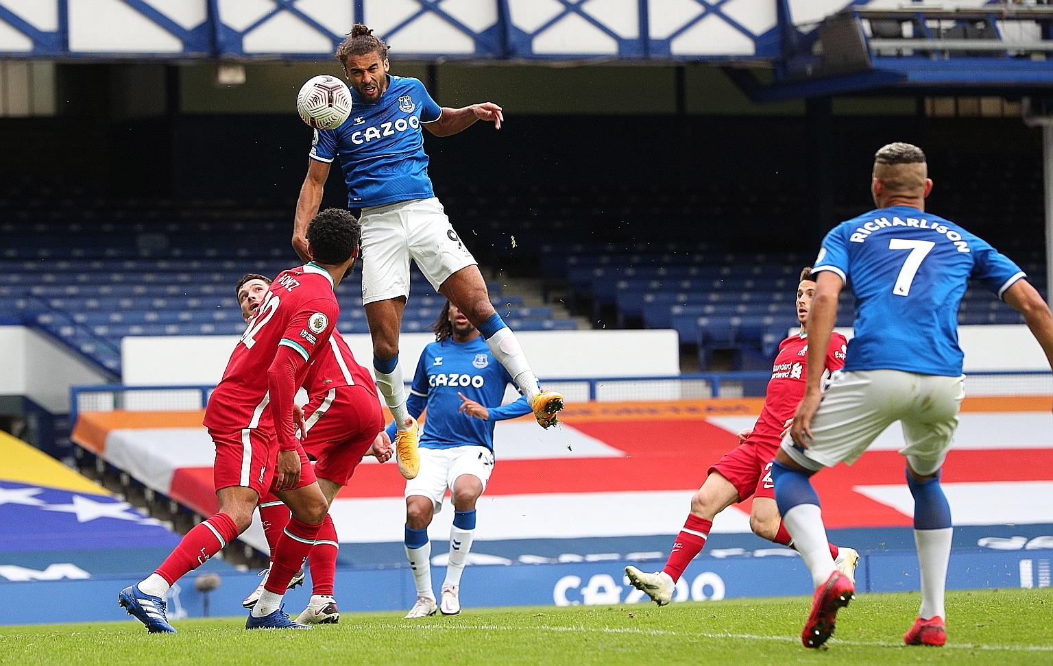 Dominic Calvert-Lewin heading in Everton's second goal in their 2-2 draw with Liverpool yesterday. It was his 10th goal of the season in all competitions.
