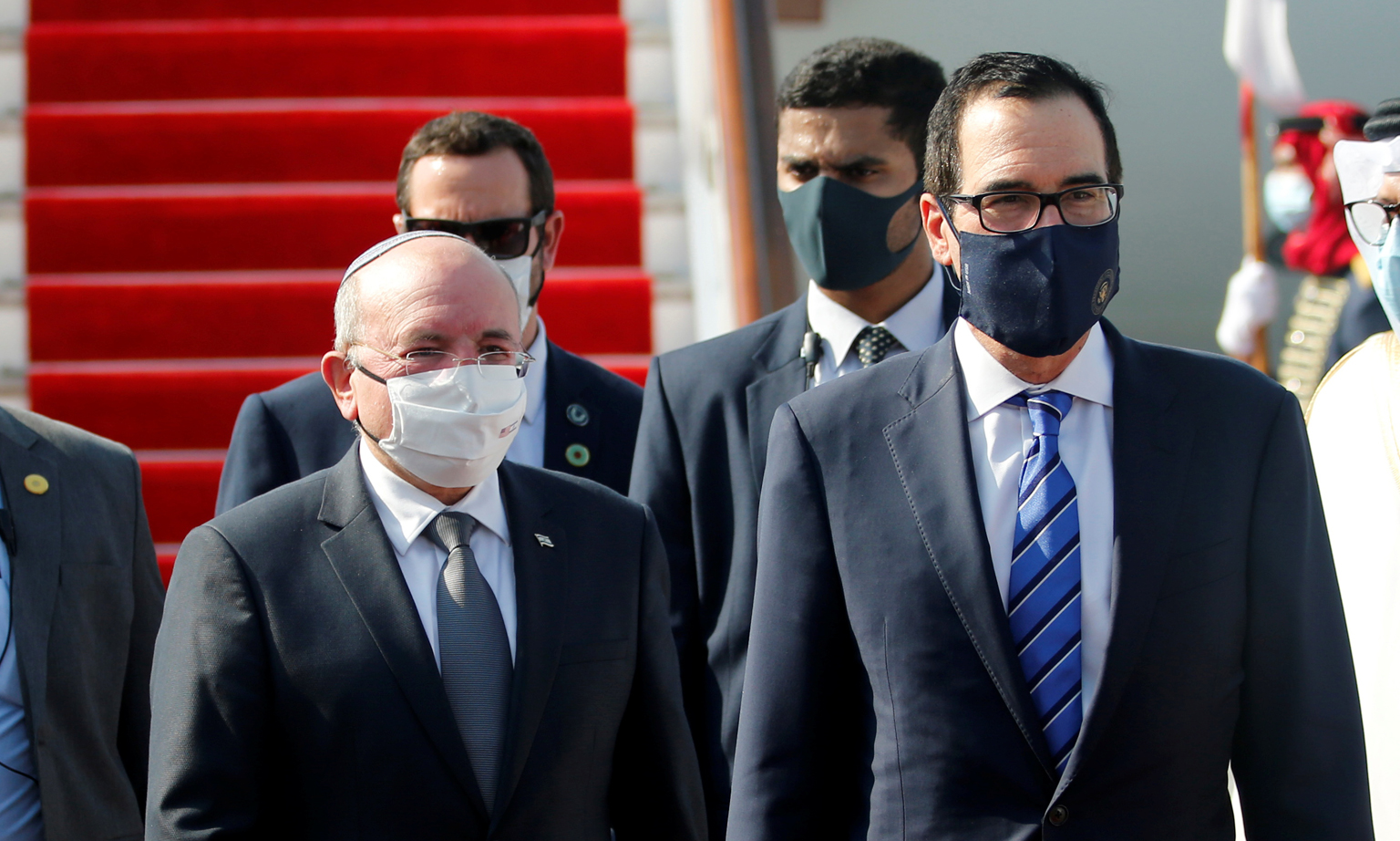 Israeli National Security Adviser Meir Ben-Shabbat (left) and US Treasury Secretary Steve Mnuchin arriving in Bahrain, yesterday. Bahrain followed the United Arab Emirates in agreeing to normalise ties with Israel.