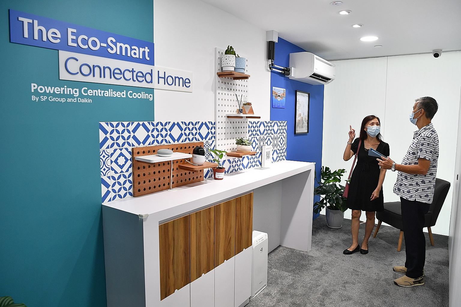 Salesman Lim Kwok Mun and his wife Susan Lee checking out the air-conditioning system at the MyTengah Experience Centre at HDB Hub in Toa Payoh yesterday. From today, future residents and members of the public can visit the centre to learn more about