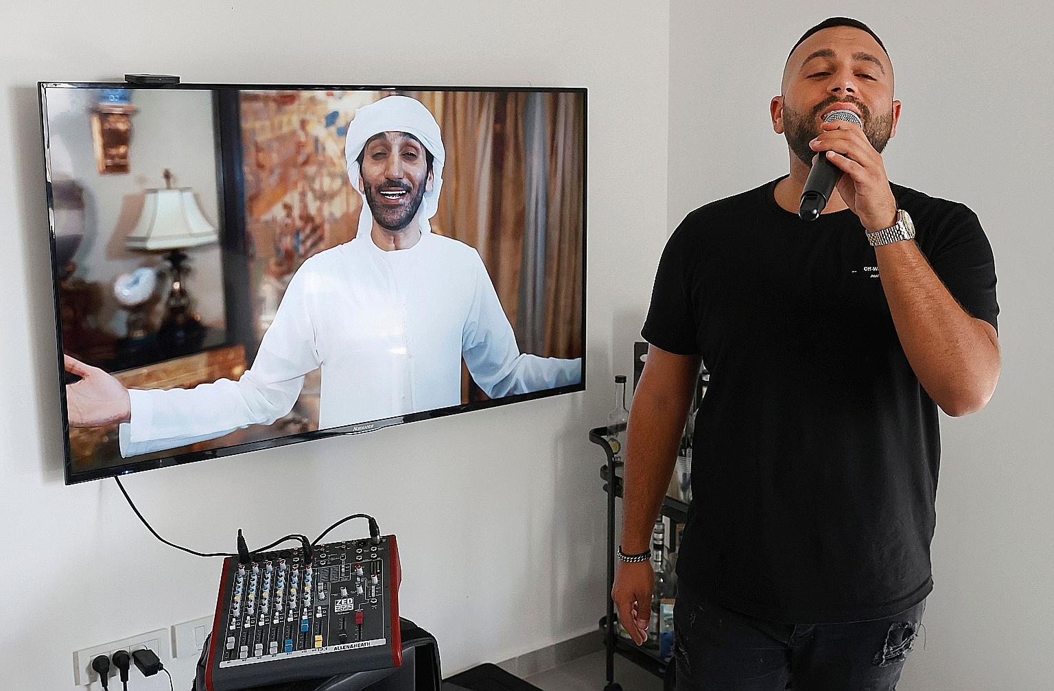 From his home in the central Israeli city of Giv'at Shmuel, Israeli singer Elkana Marziano croons along to a song, a collaboration with Emirati artist Walid Aljasim (on screen).