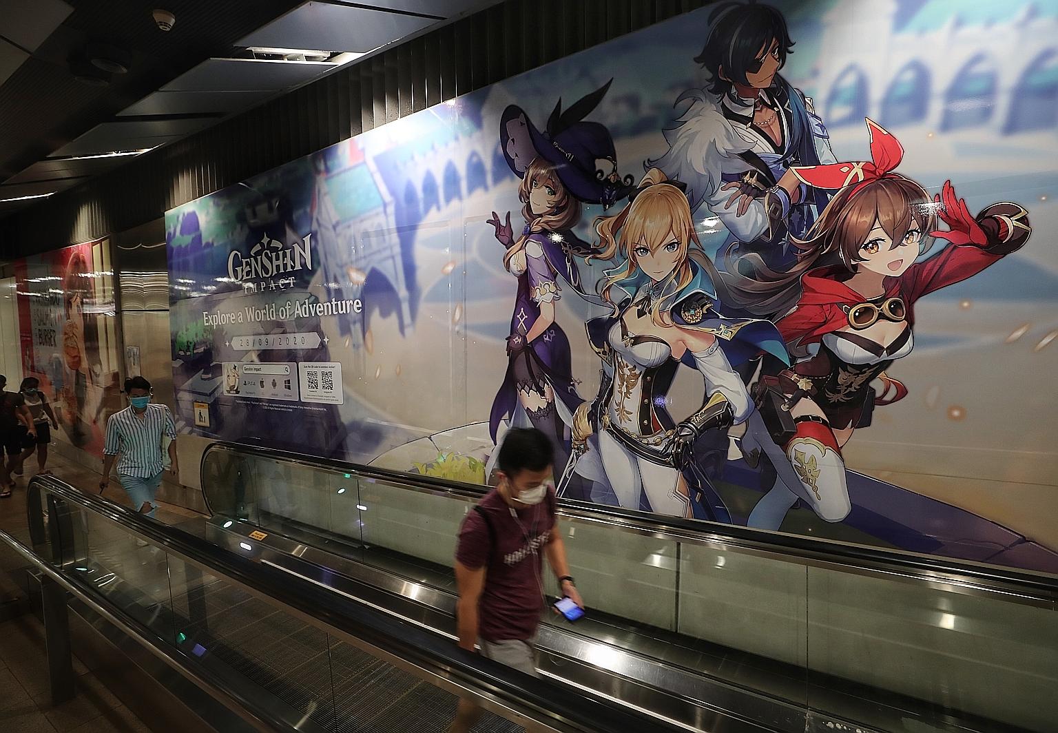 A massive advertisement for the free-to-play mobile game Genshin Impact at Serangoon MRT station. Concerns are mounting that such games, which feature gambling-like elements, commonly called loot boxes, are gaining mainstream prominence here. ST PHOT