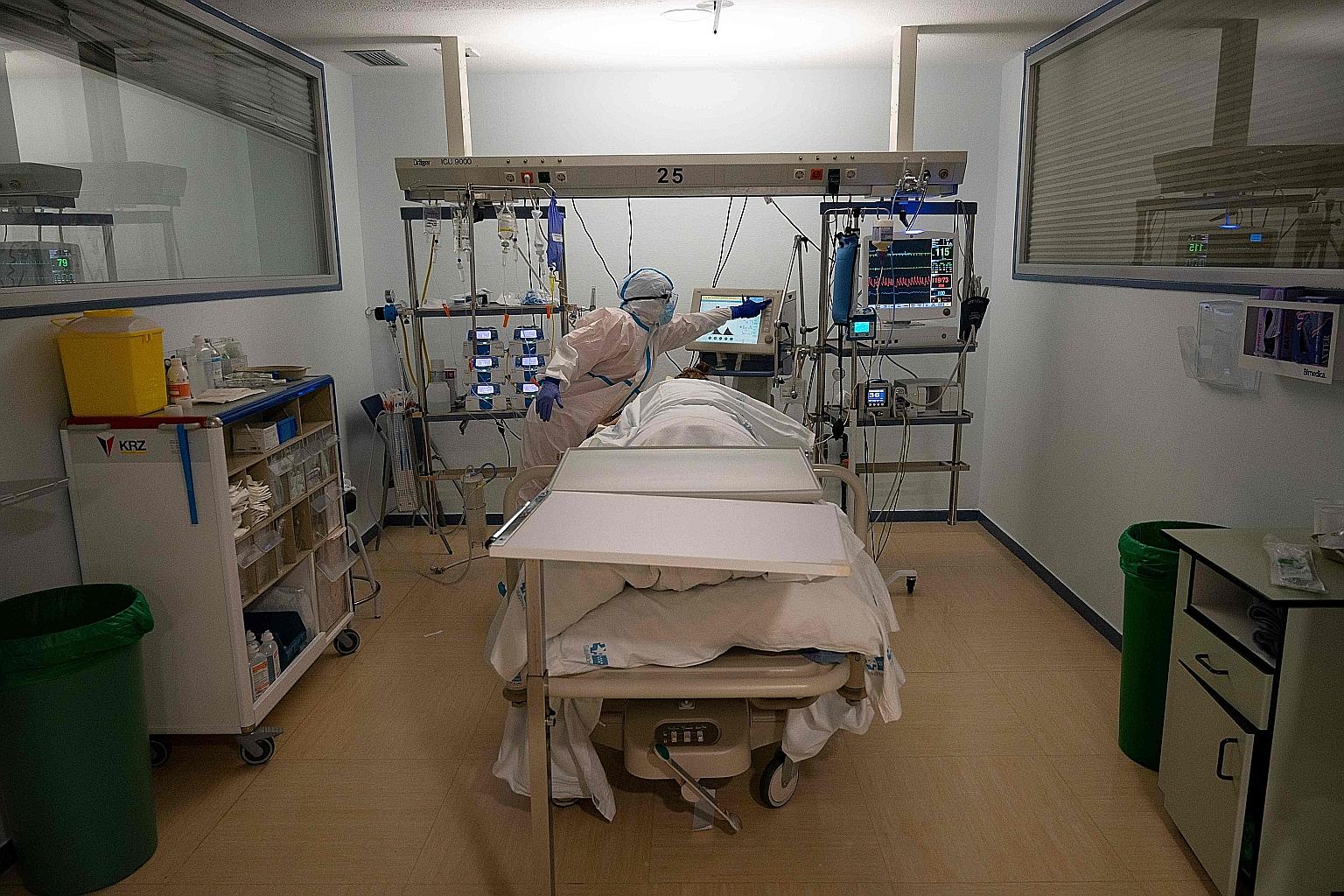 A healthcare worker attending to a coronavirus patient at the intensive care unit of the Severo Ochoa University Hospital in Leganes in Madrid last week. Virus cases surpassed one million in Spain on Wednesday.