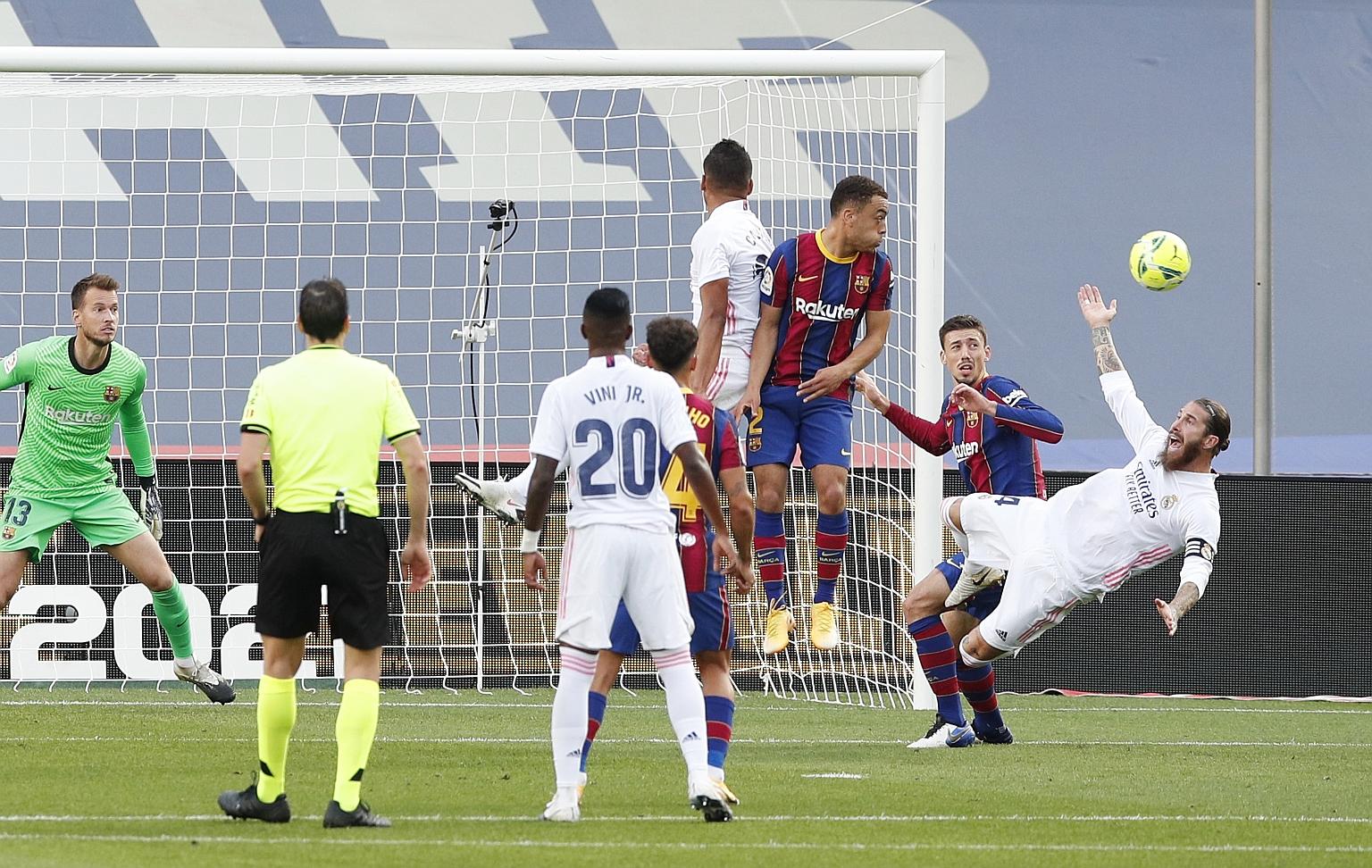 Real captain Sergio Ramos is fouled in the penalty box by Barcelona's Clement Lenglet. He scored the resultant penalty to restore the visitors' lead at the Nou Camp and they went on to take all three points.