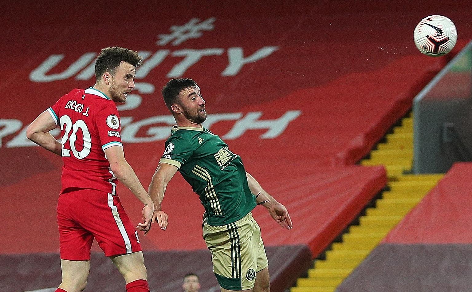 Liverpool striker Diogo Jota's header in the 64th minute gave the champions a 2-1 home victory over Sheffield United. They are now second in the league table, behind only Merseyside rivals Everton.