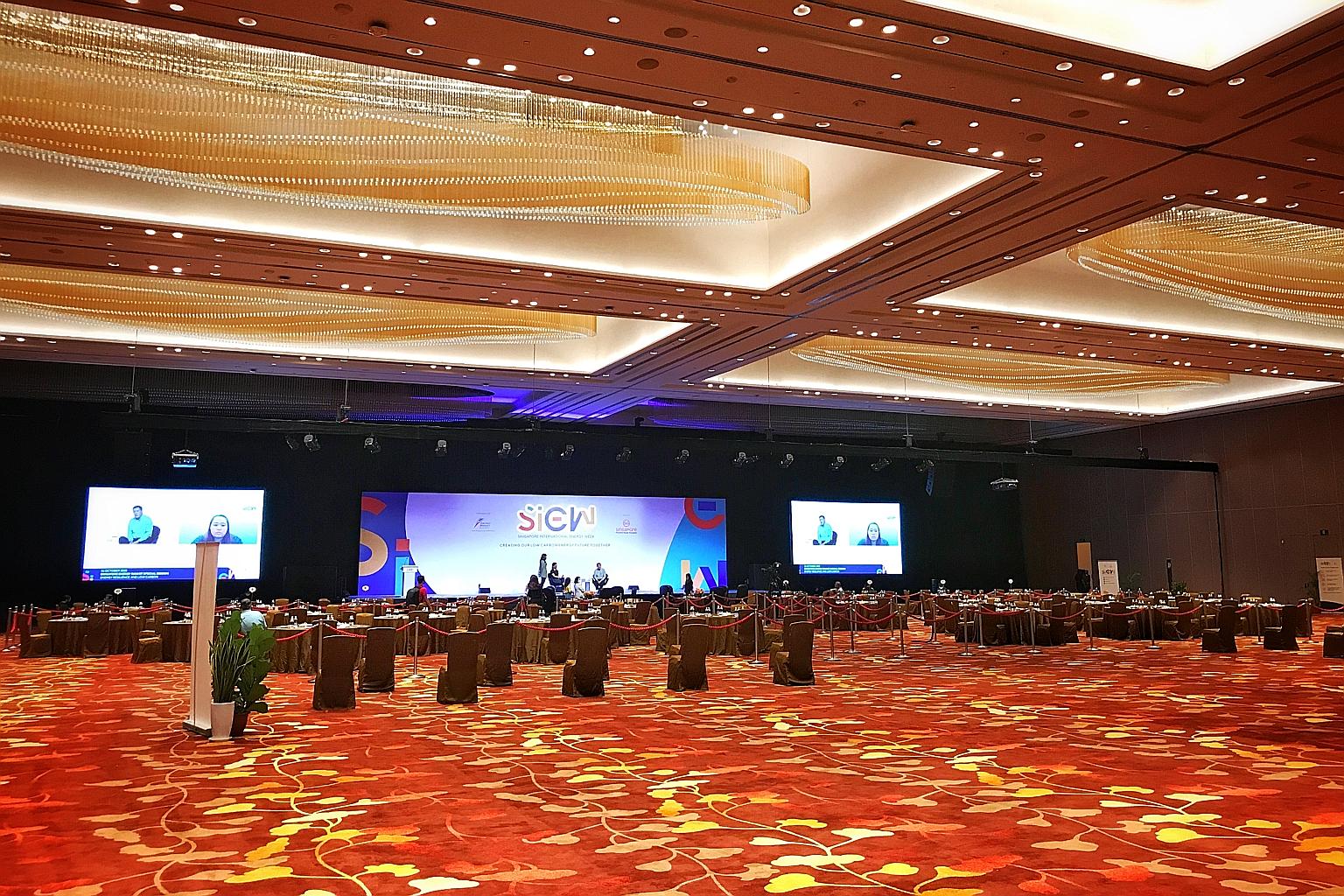 Preparations being made at the Sands Expo and Convention Centre yesterday, before the Singapore International Energy Week 2020 kicks off today. Participants will still need to wear a mask and observe safe distancing rules. ST PHOTO: KEVIN LIM