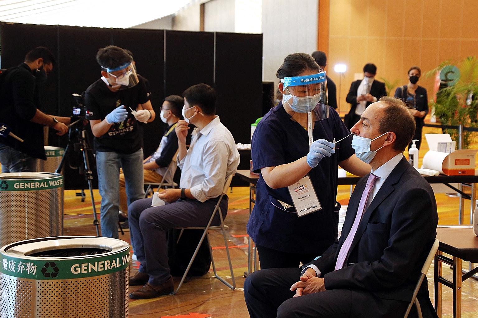 Participants being swabbed yesterday morning before attending conferences at the Singapore International Energy Week 2020. Around 215 tests were carried out yesterday, and most people appeared to have no issues with them. No one tested positive.