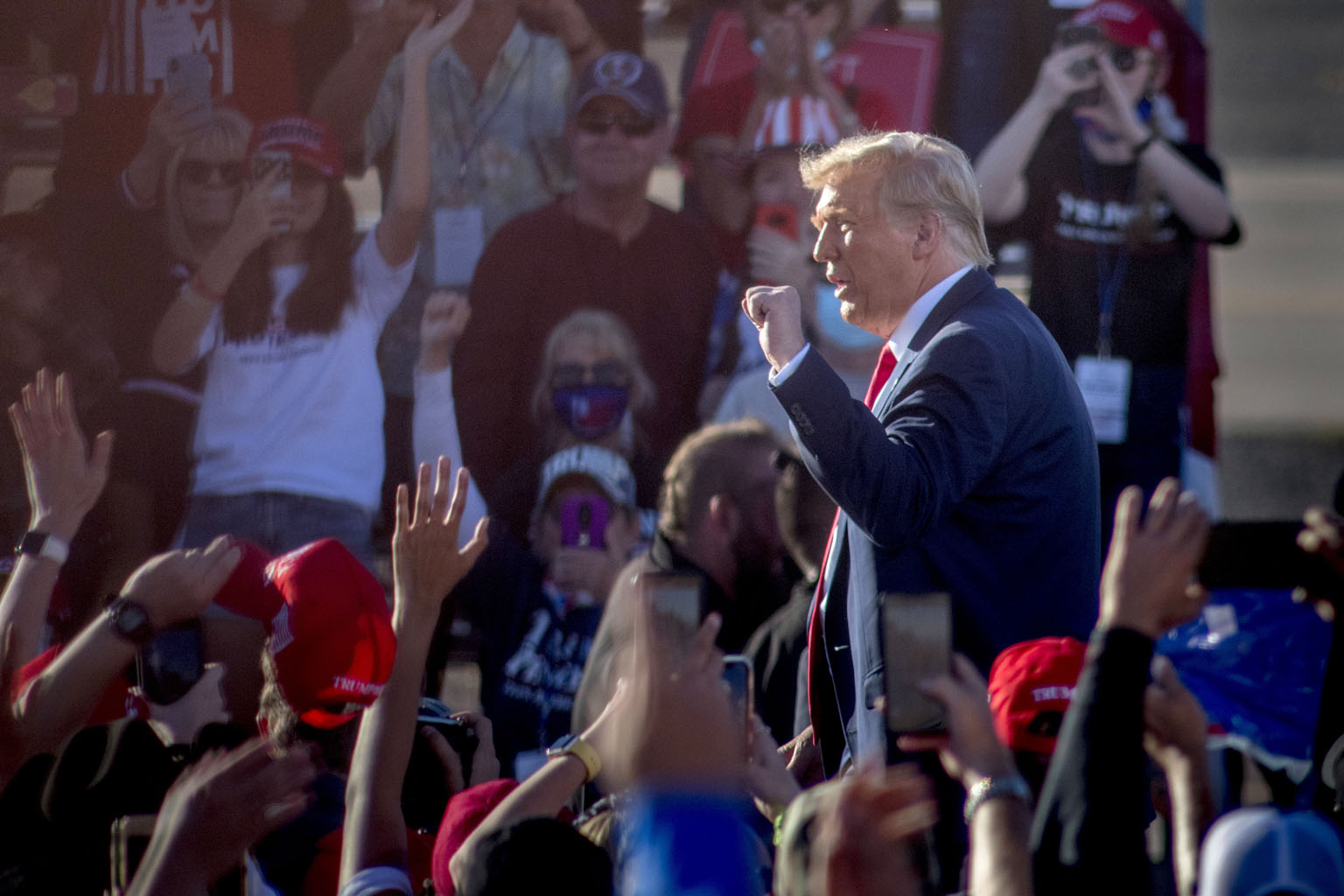 US President Donald Trump at a rally at Goodyear Airport in Phoenix, Arizona, on Wednesday. The pandemic that has upended life across the US, killing more than 227,000 people, is roaring back in the days leading up to next Tuesday's contest between t