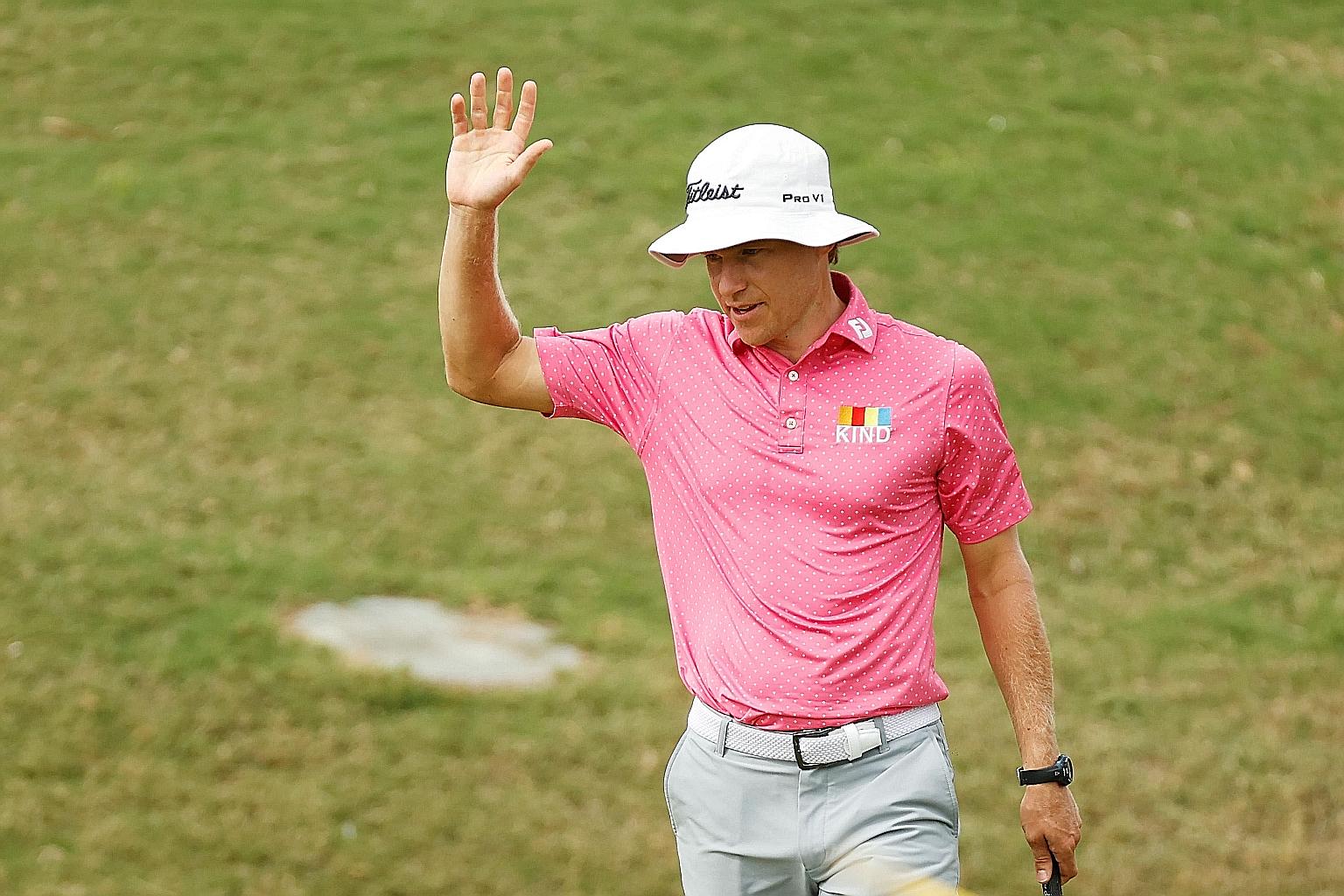 American Peter Malnati acknowledging spectators' applause after his birdie on the 18th green during the first round of the Bermuda Championship at Port Royal Golf Course on Thursday.