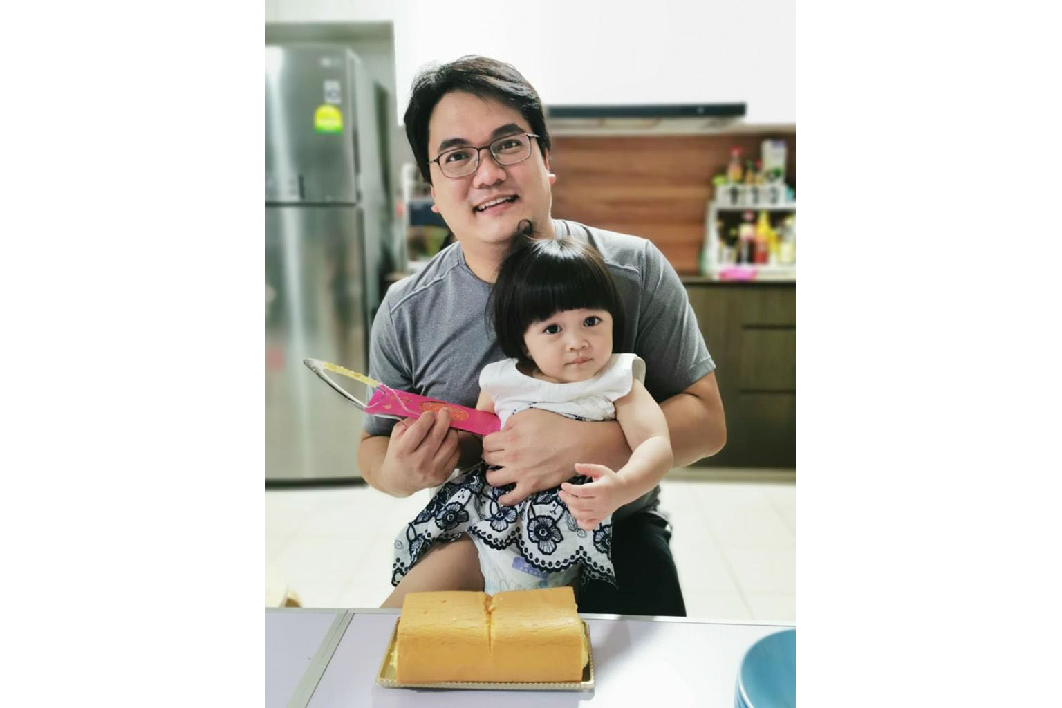Mr Gregory Chua, 32, who used to work as a research associate specialising in 3D printing, has found a new career as a senior additive manufacturing engineer at local engineering firm 3D Metalforge. He is seen here with his two-year-old daughter Eric