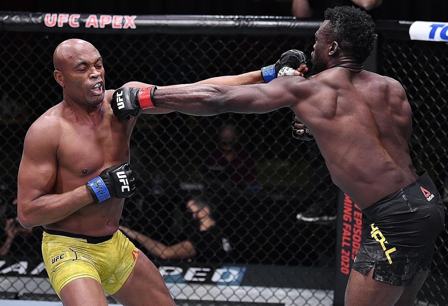 In his last fight in the Ultimate Fighting Championship (UFC), Anderson Silva (far left) suffered a fourth-round technical knockout defeat by Uriah Hall in Las Vegas on Saturday. The mixed martial arts great still holds the record for the longest tit