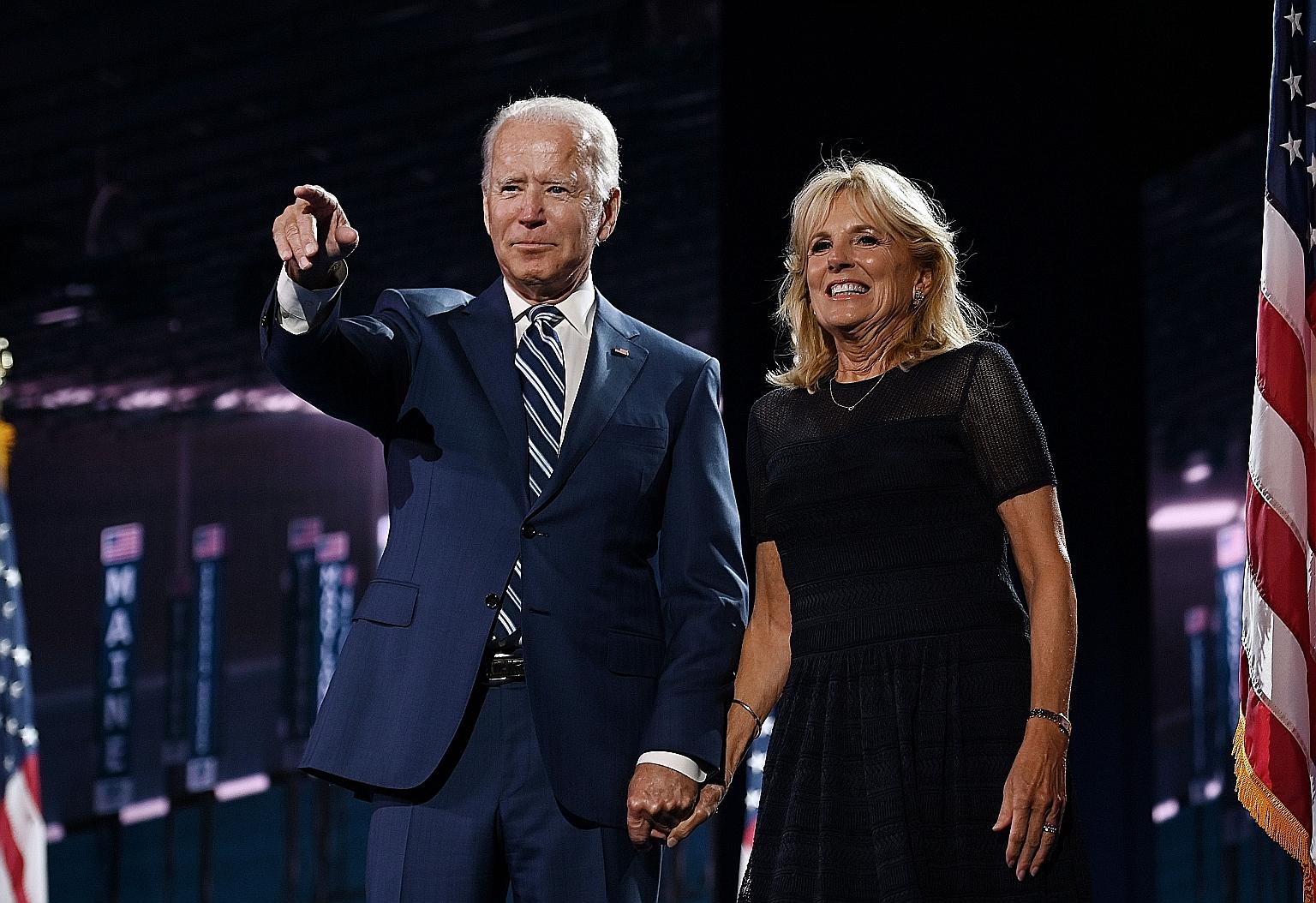 Mr Joe Biden and his wife Jill on stage at the Democratic National Convention, held virtually amid the coronavirus pandemic, at the Chase Centre in Wilmington, Delaware, in August.