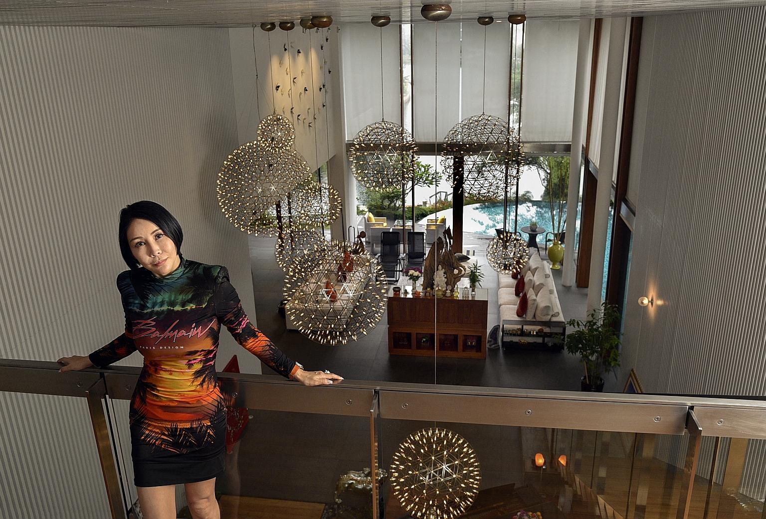 Ms Mathilda Koh, seen in her current home at Sentosa Cove, is confident that prices in the posh seaside enclave will recover.