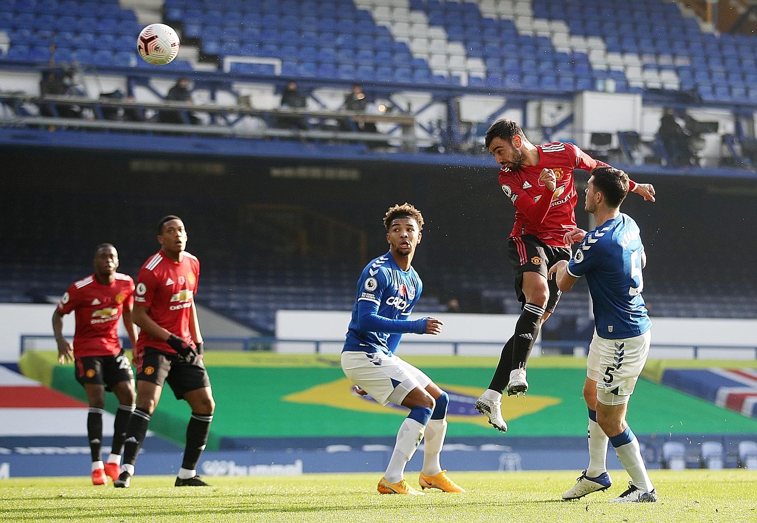 Bruno Fernandes meeting a Luke Shaw cross from the left with a perfectly angled header to equalise in yesterday's match at Everton. The midfielder scored twice and had an assist. PHOTO: REUTERS