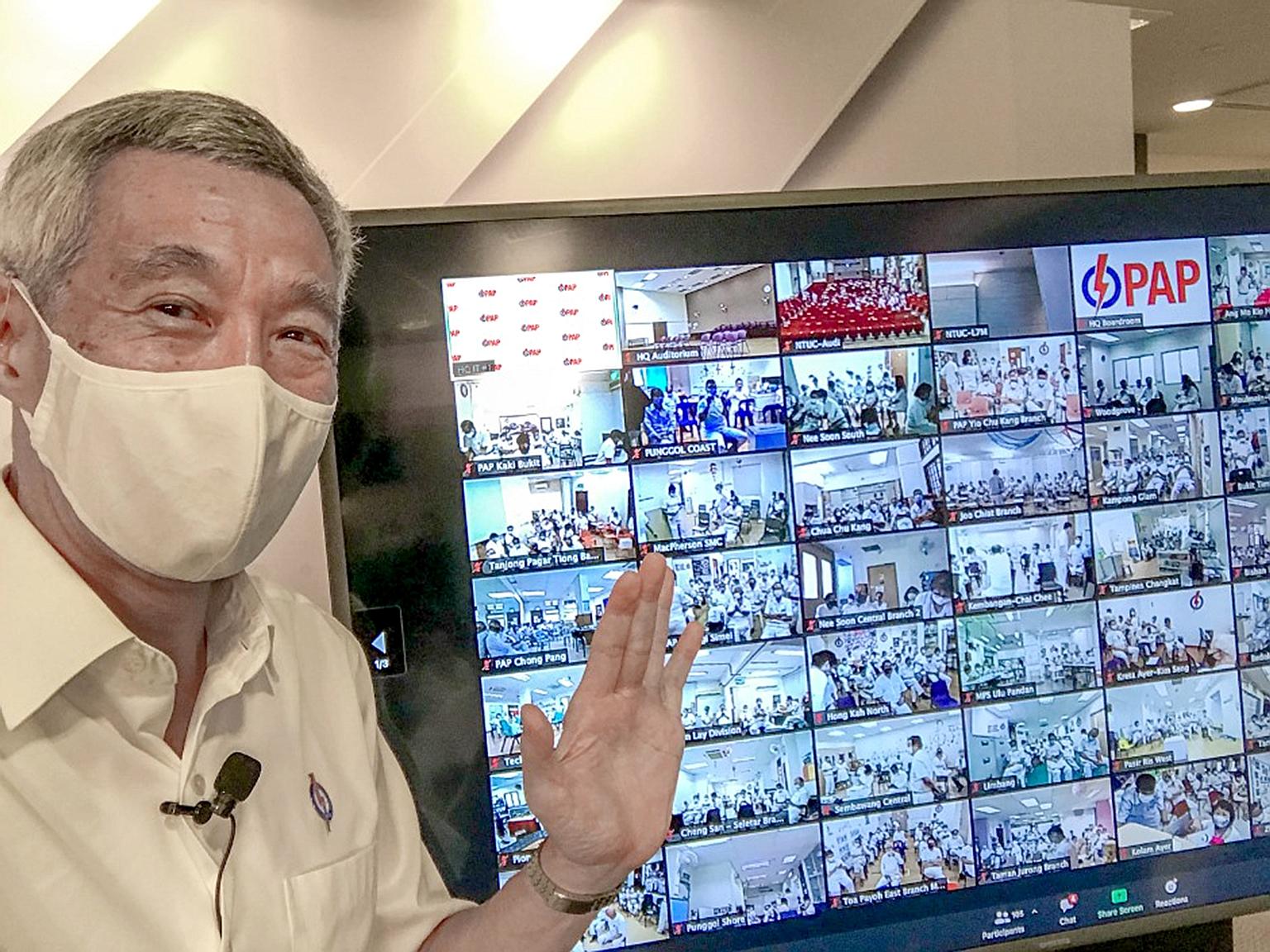 Prime Minister Lee Hsien Loong taking a "screen-wefie" with People's Action Party cadres yesterday. He said in his Facebook post: "Found a way to meet everyone - virtually! I took a screen-wefie with our PAP comrades who were tuning in from their res
