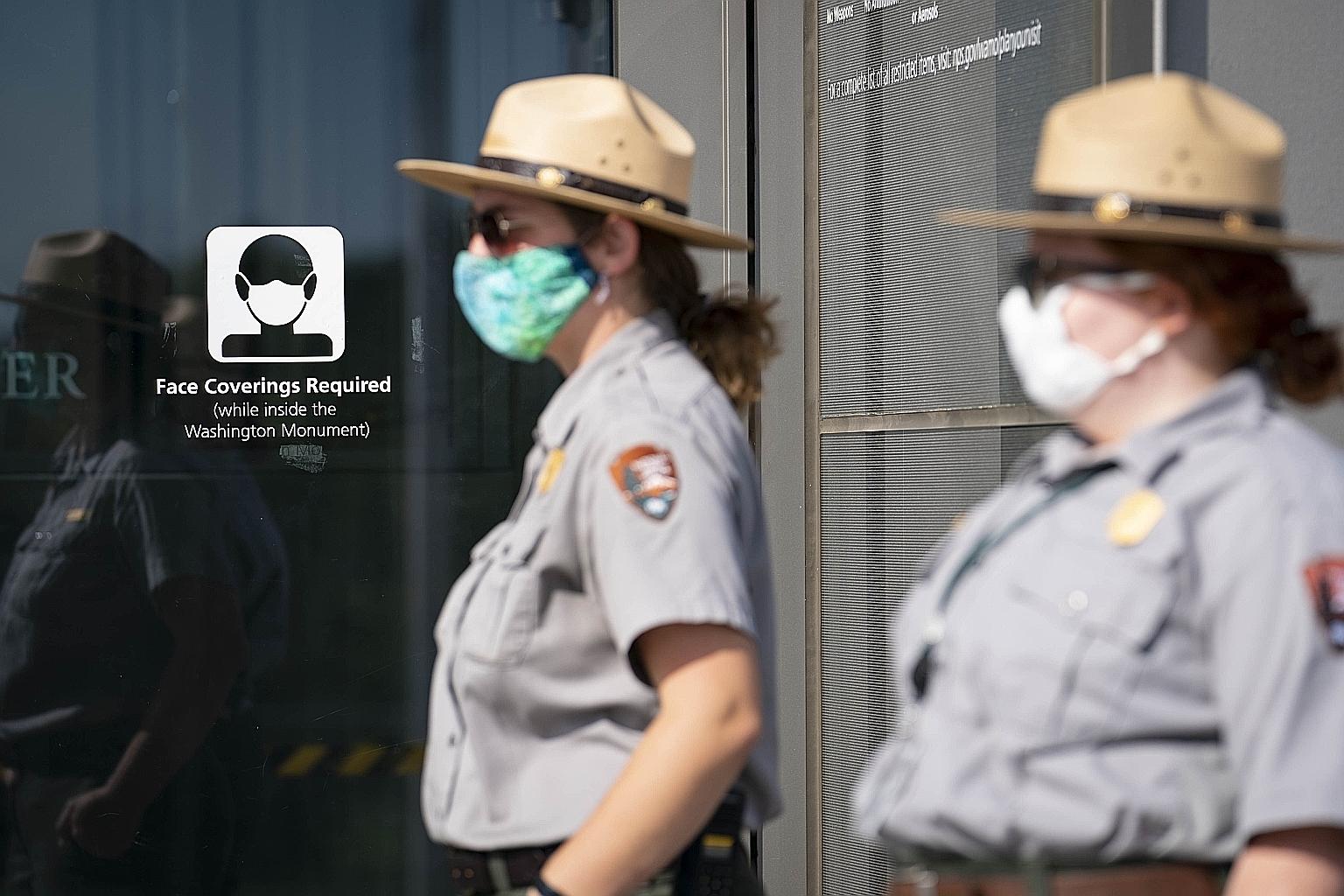 National Park Service Rangers wearing protective face masks at the reopening of the Washington Monument on Oct 1, after months of closures due to the coronavirus pandemic. PHOTO: AGENCE FRANCE-PRESSE
