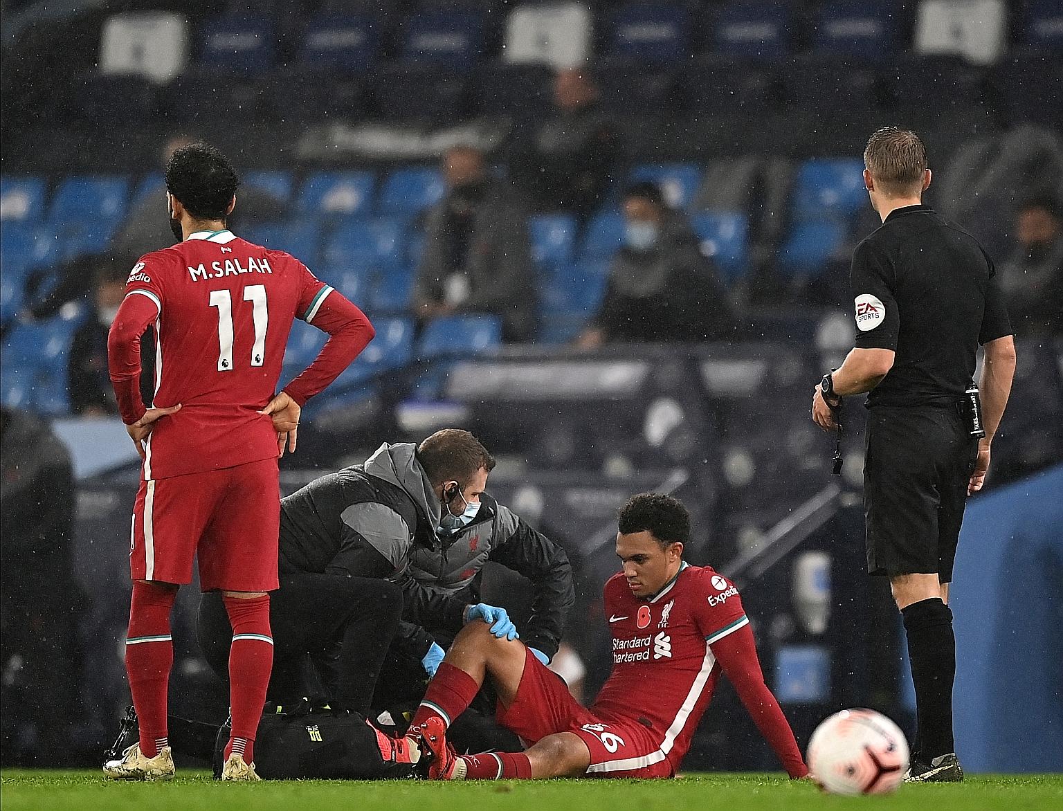 Liverpool's Trent Alexander-Arnold receiving treatment after suffering an injury during the 1-1 Premier League draw with Manchester City.