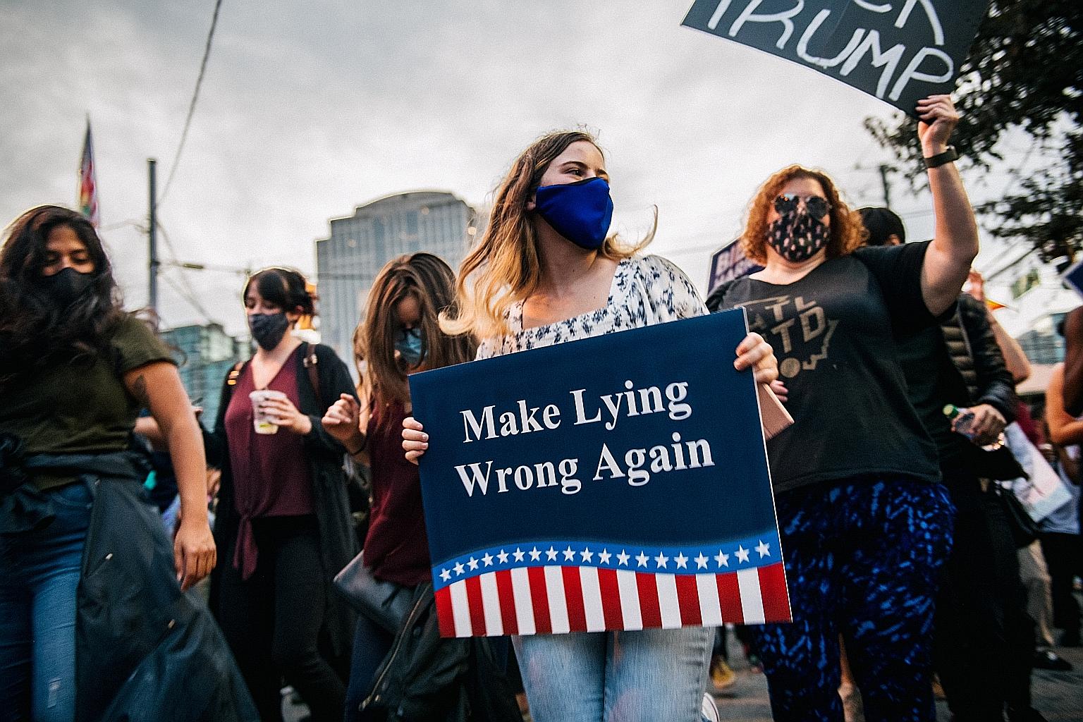 People in Atlanta, Georgia, celebrating last Saturday after the American media announced that Democratic candidate Joe Biden had won this year's US presidential election. A survey and an analysis of election results showed that, in general, Mr Biden 