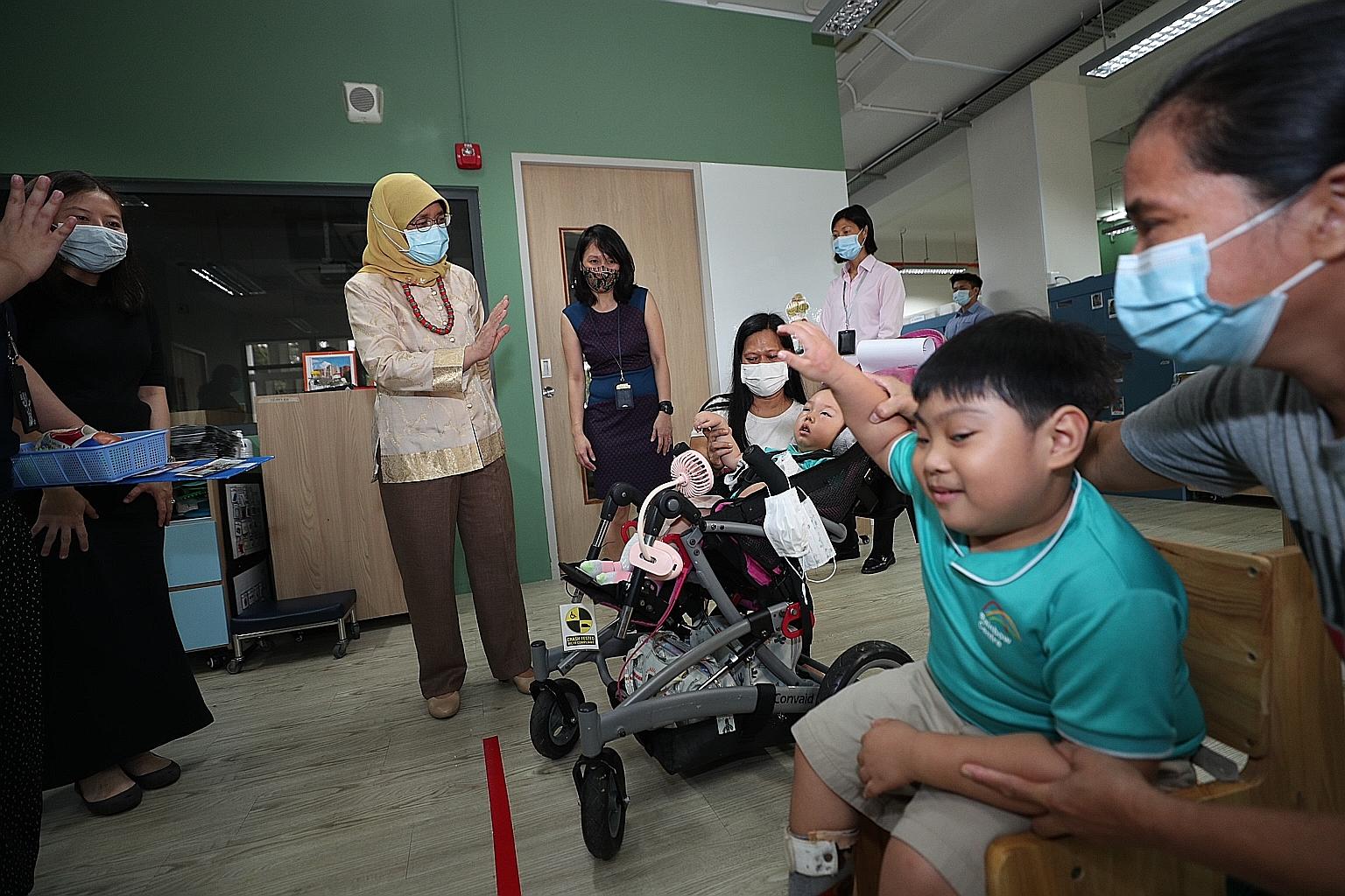 President Halimah Yacob visited Rainbow Centre in Margaret Drive in Queenstown yesterday, and was briefed about its developmental and vocational training programmes for young people with disabilities. She also toured the centre's OOSH (out-of-school