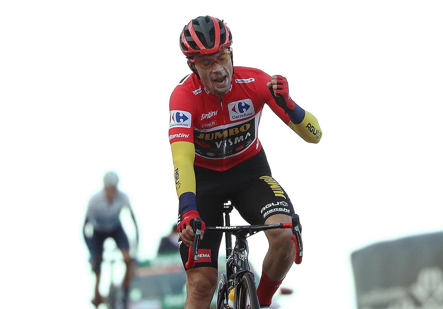 Primoz Roglic of Jumbo-Visma celebrating after crossing the finish line in the 17th stage of the Vuelta a Espana.