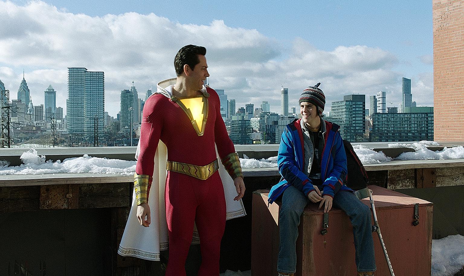 Zachary Levi (far left) and Jack Dylan Grazer (left) in Shazam! Jason Momoa in Aquaman.