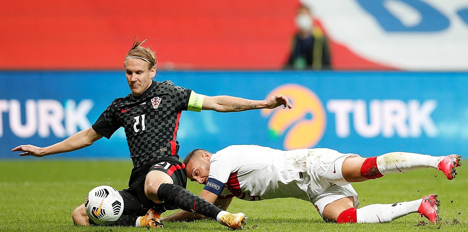 Croatia's Domagoj Vida tackling Cenk Tosun during the friendly match against Turkey before he was substituted before the second half following news that he had tested positive for Covid-19.