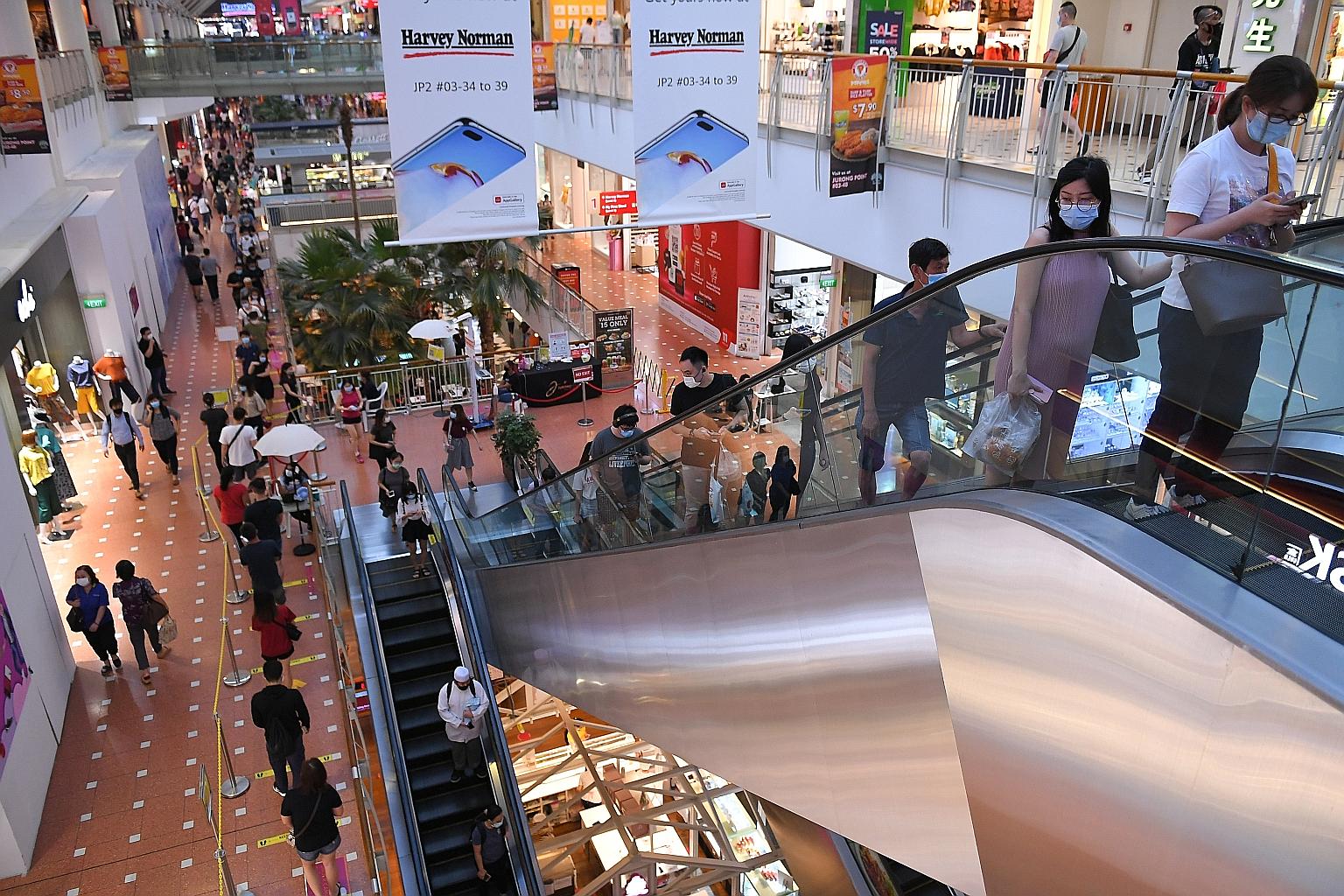 Shoppers at Jurong Point earlier this year. Researchers found that heartland districts, particularly in western Singapore, recorded a boost in retail, while overall spending in the Central Business District and the city took a hit.