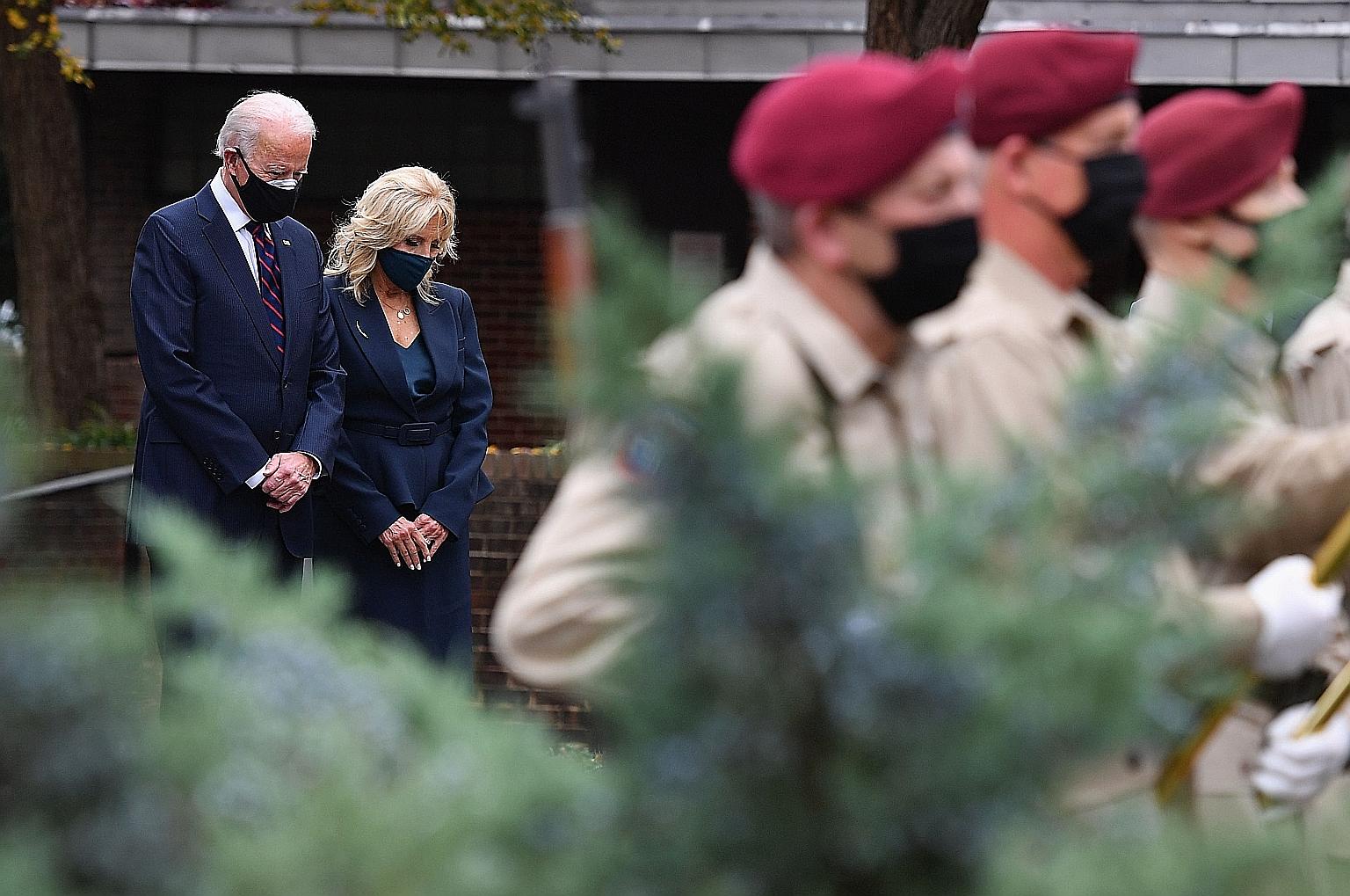 Left: Mr Joe Biden and his wife Jill paying their respects during a Veterans Day stop at the Korean War Memorial Park in Philadelphia on Wednesday. South Korean officials are hopeful that Mr Biden will quickly resolve a drawn-out, multi-billion-dolla