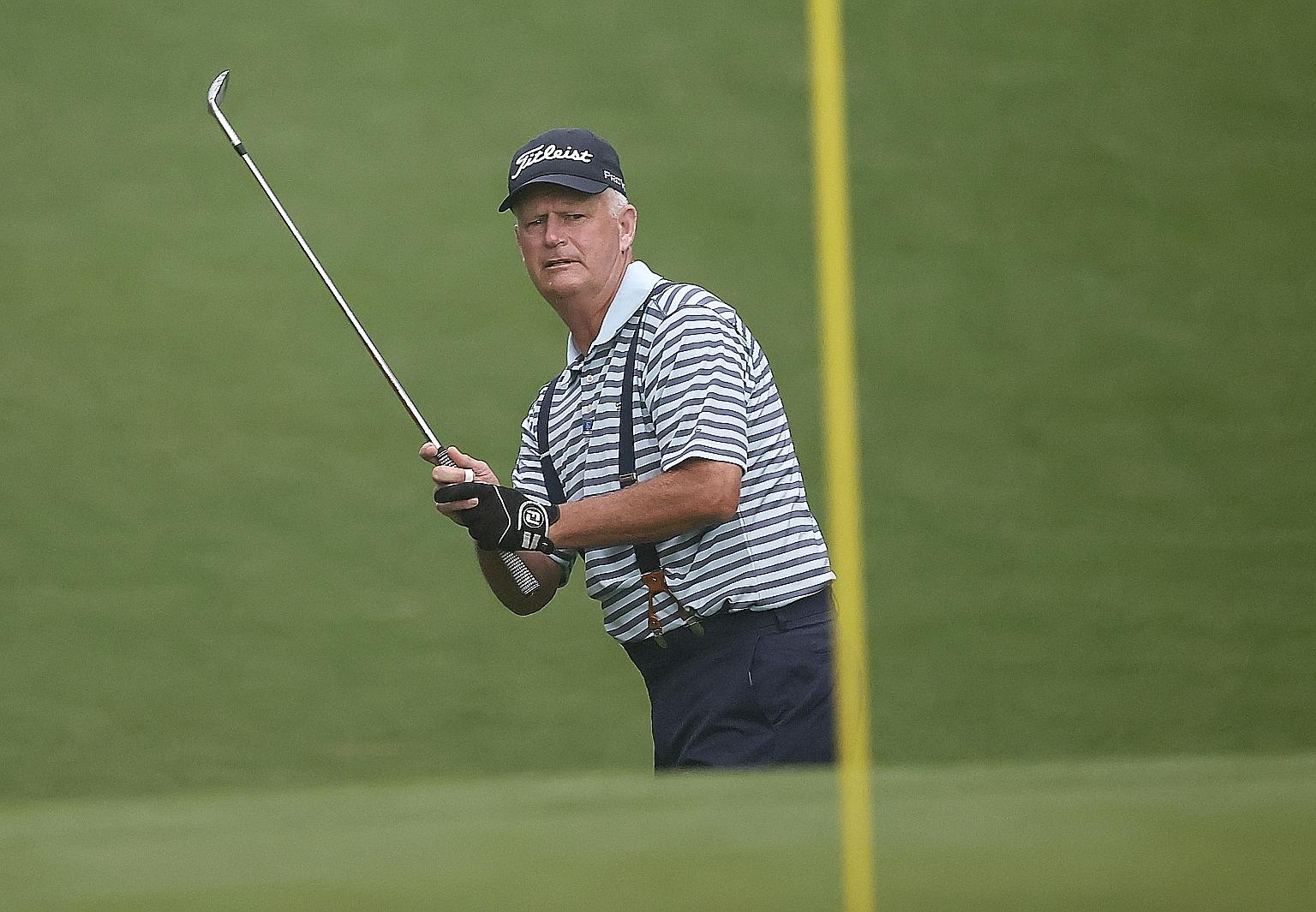 Scotland's Sandy Lyle chipping a shot on the 10th hole at Augusta yesterday. At 62, Lyle is one of the elder statesman among the field, which has appeared to be an advantage for competitors at the Masters.