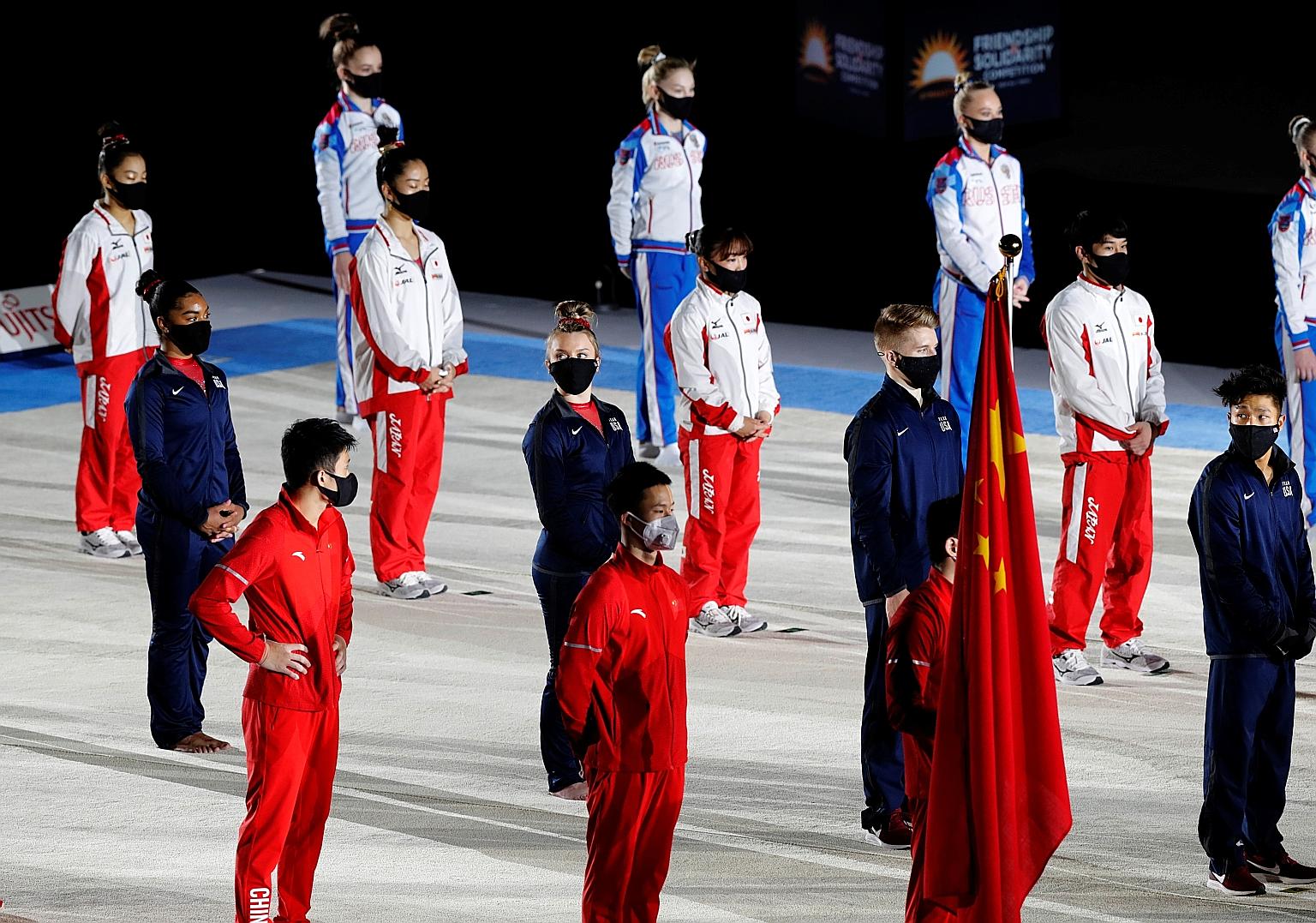 Competitors staying physically distanced during the opening ceremony of the "Friendships and Solidarity Competition" in Tokyo which gathered 30 gymnasts from Japan, China, Russia and the US. PHOTO: REUTERS